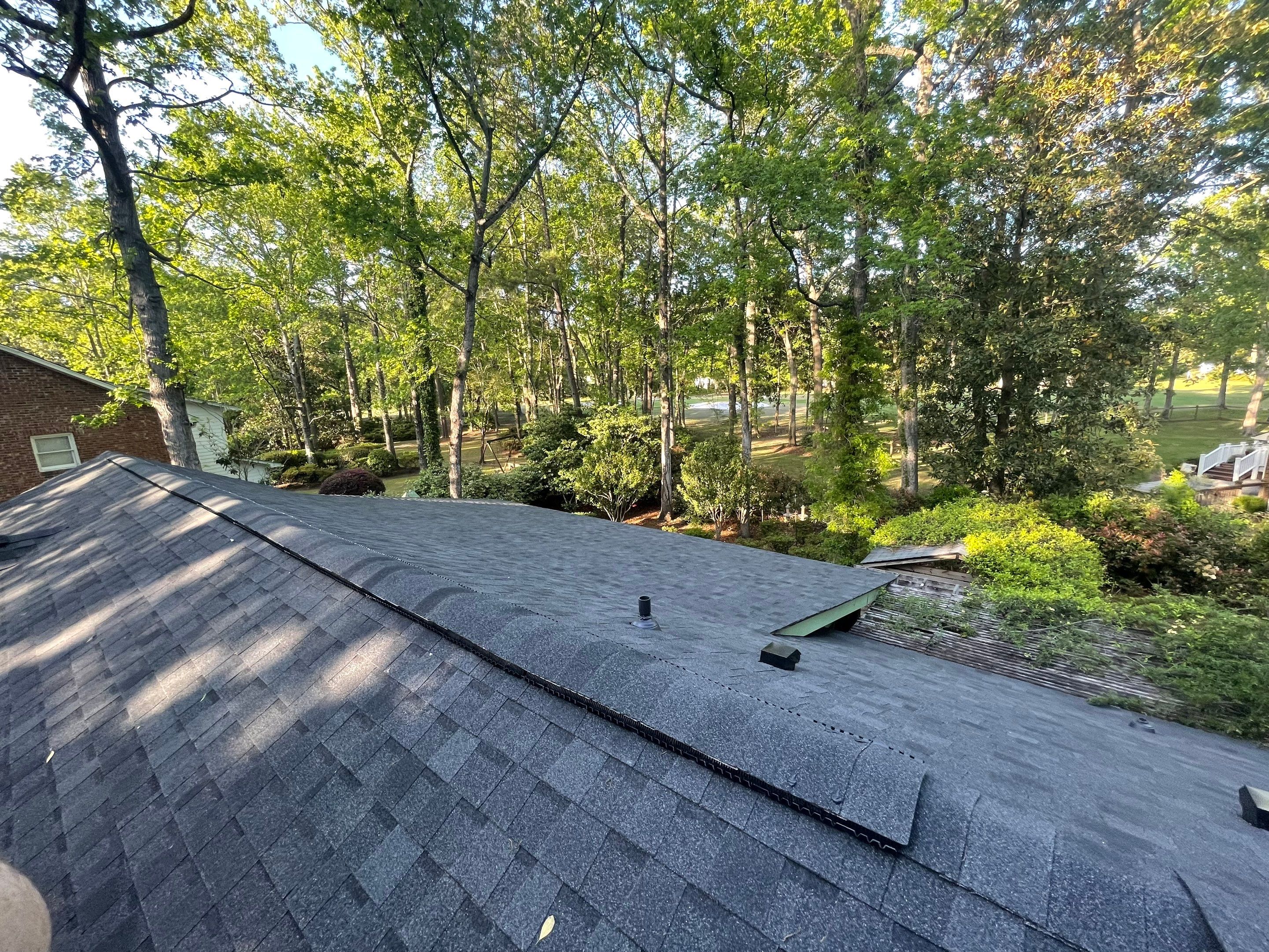 Hail Damage using Atlas Pristine Pinnacle Shingles by Artigues Roofing & Restoration Services