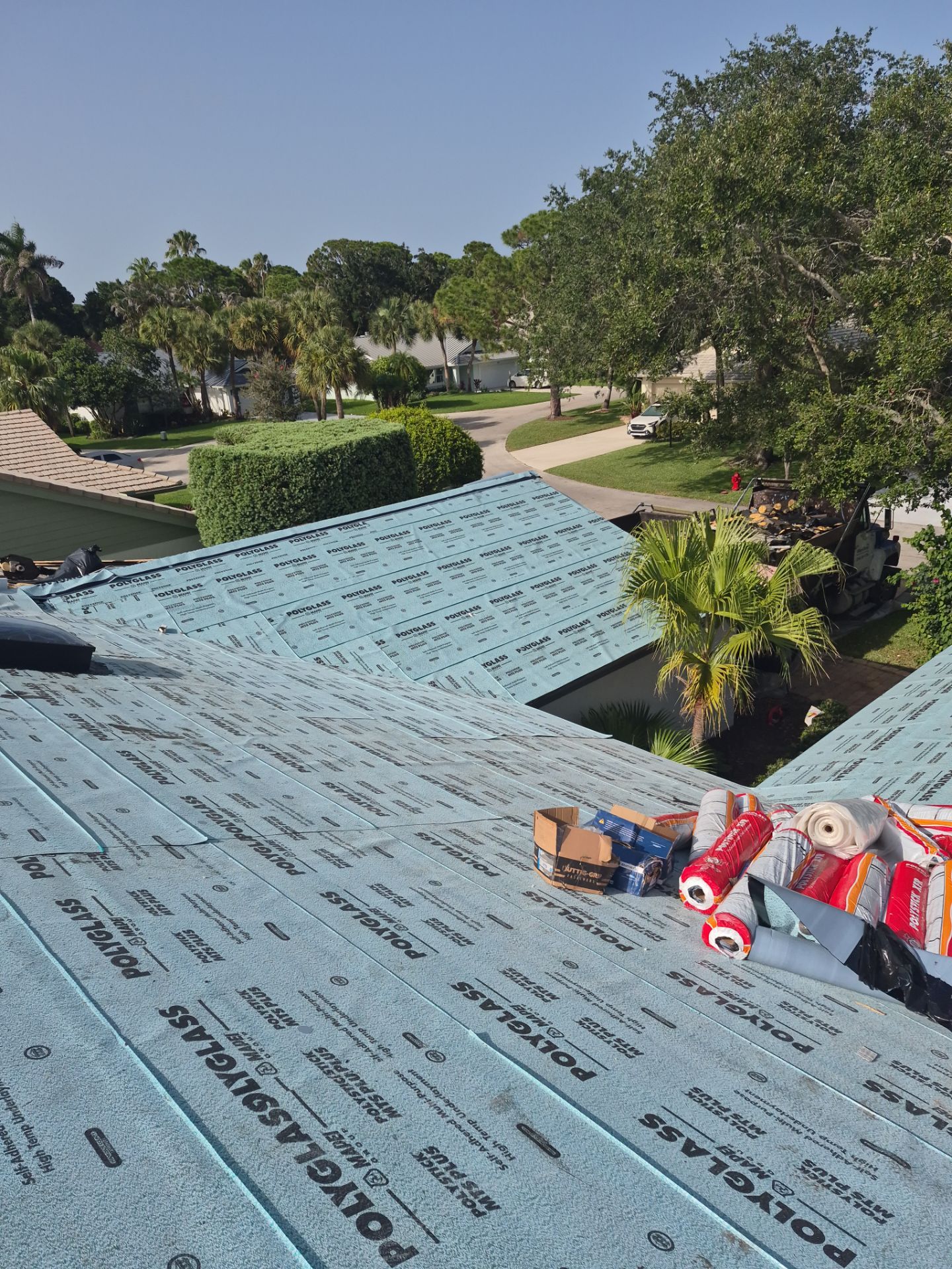 Standing Seam Metal Charcoal Grey Roof Replacement and Skylight Installation in Jupiter by Art's Roofing & Construction