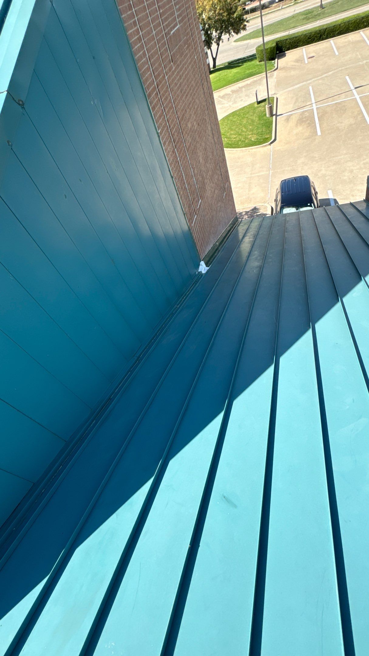 Commercial Roofing Repair using TRP #924 Eterna-Sil Premium Silicone Roof Coating by Harvey Roofing & Construction