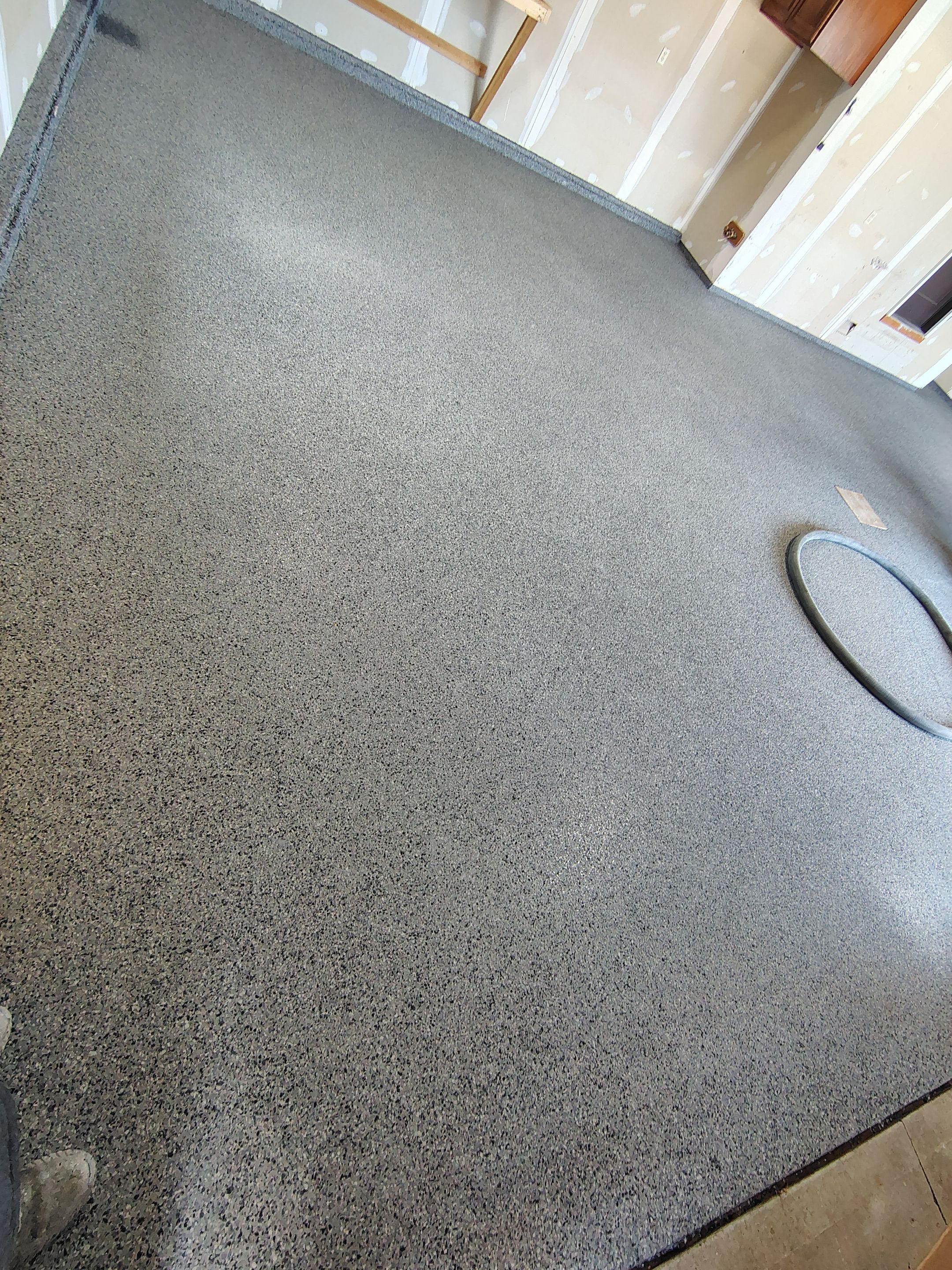 Sioux Falls Garage Concrete Grinding and Nightfall Decorative Chip Coating by Select Painting, Coatings & Garage Cabinets