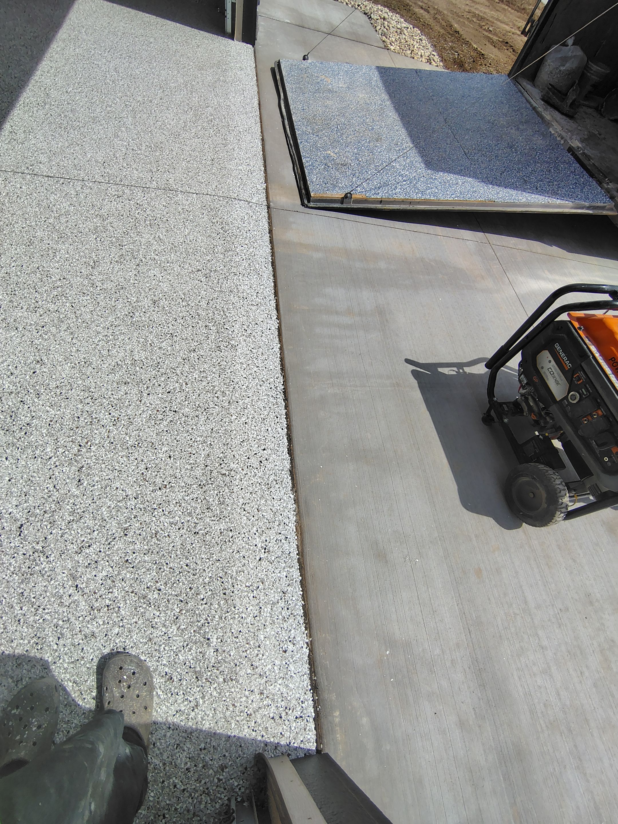 Speckled Epoxy Garage Floor Coating Installation in Sioux Falls by Select Painting, Coatings & Garage Cabinets