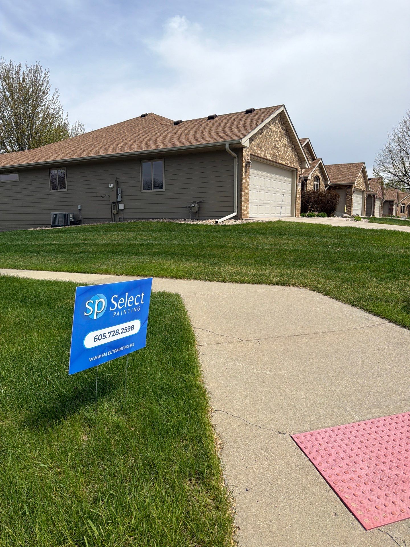 Residential Exterior Siding and Trim Painting in Sioux Falls by Select Painting, Coatings & Garage Cabinets