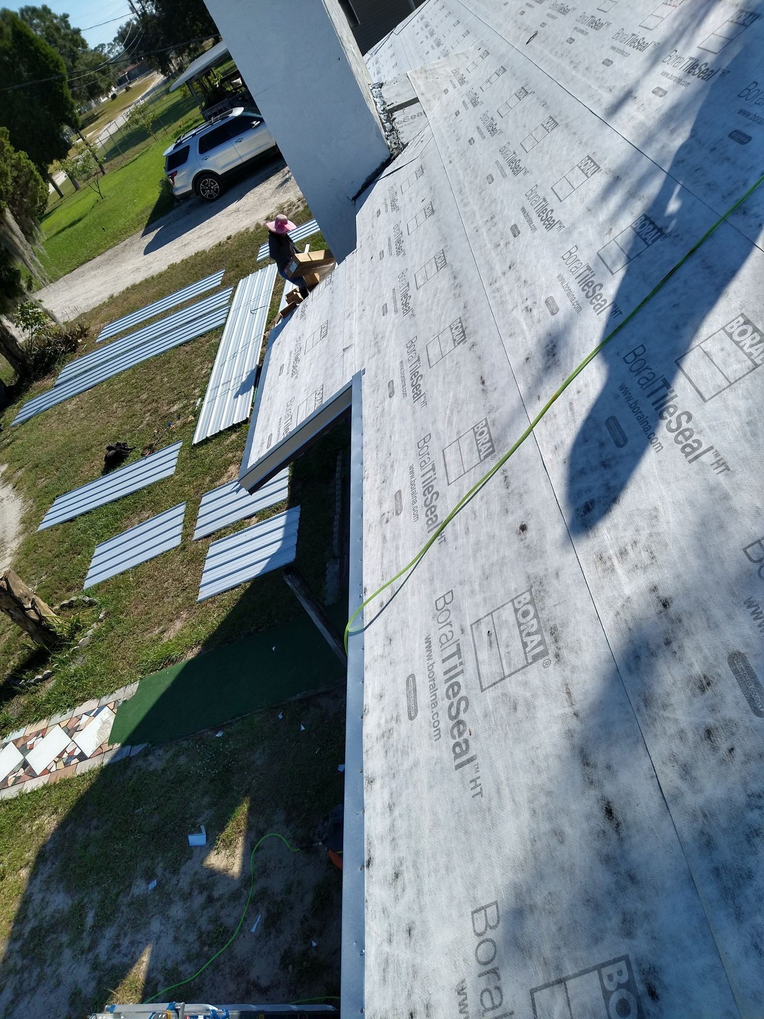 Residential Roofing Installation using 26 GA Rib Panel Galvalume by 1st Class Roofing, Inc.