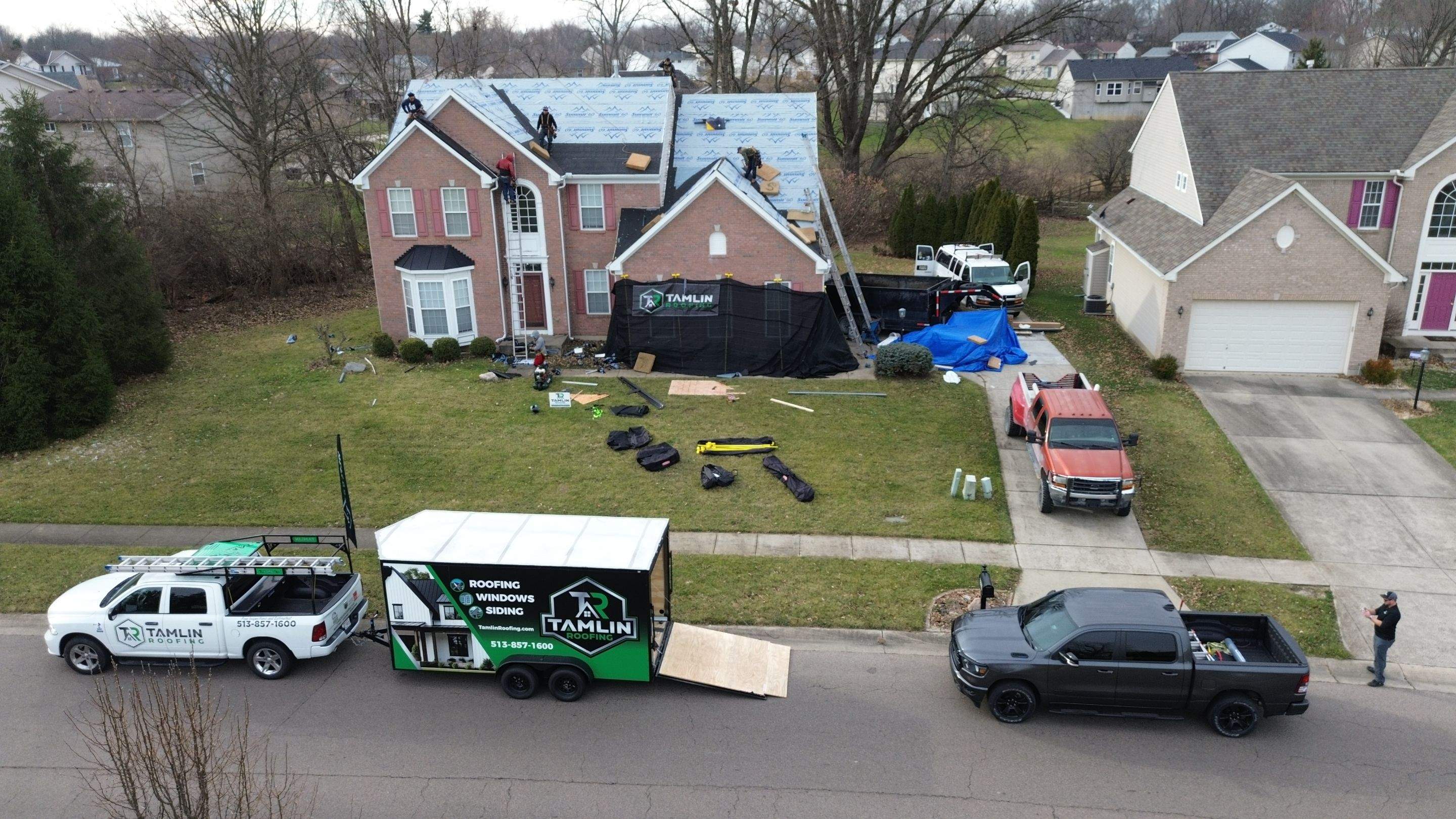 Walden Ponds - Pristine Black and Hydro Flo Gutter Guards by Tamlin Roofing
