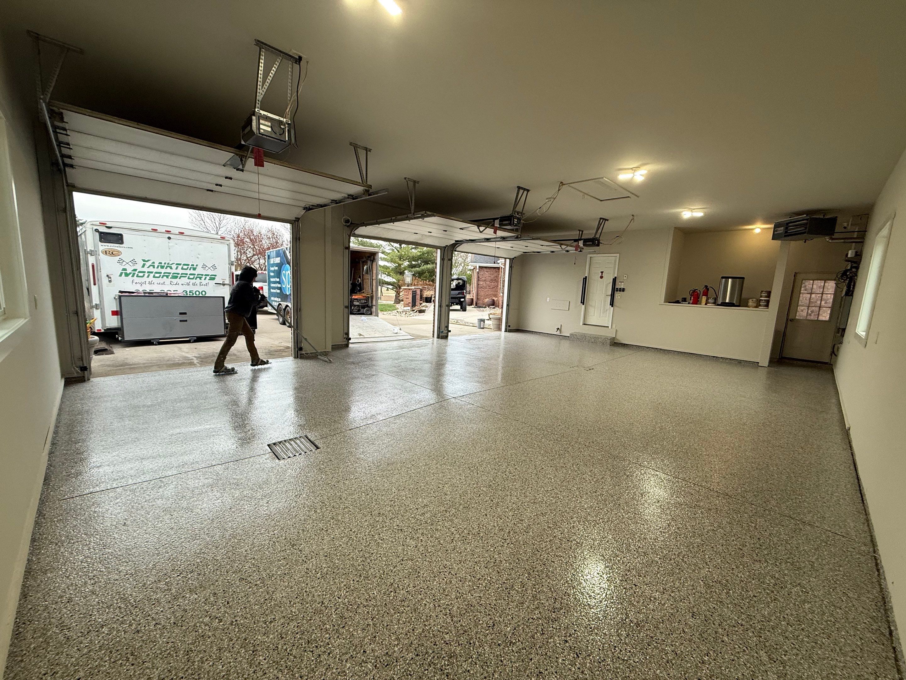 Garage transformation in Yankton by Select Painting, Coatings & Garage Cabinets