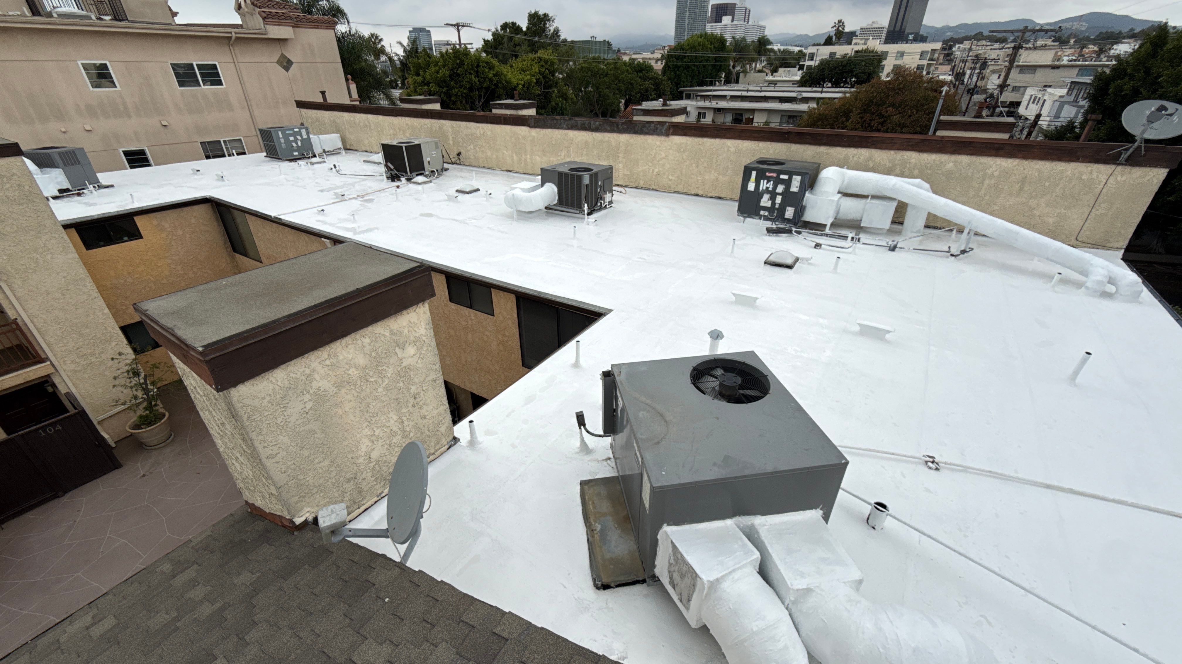 Apartment Building Silicone Coating by Hull Brothers Roofing
