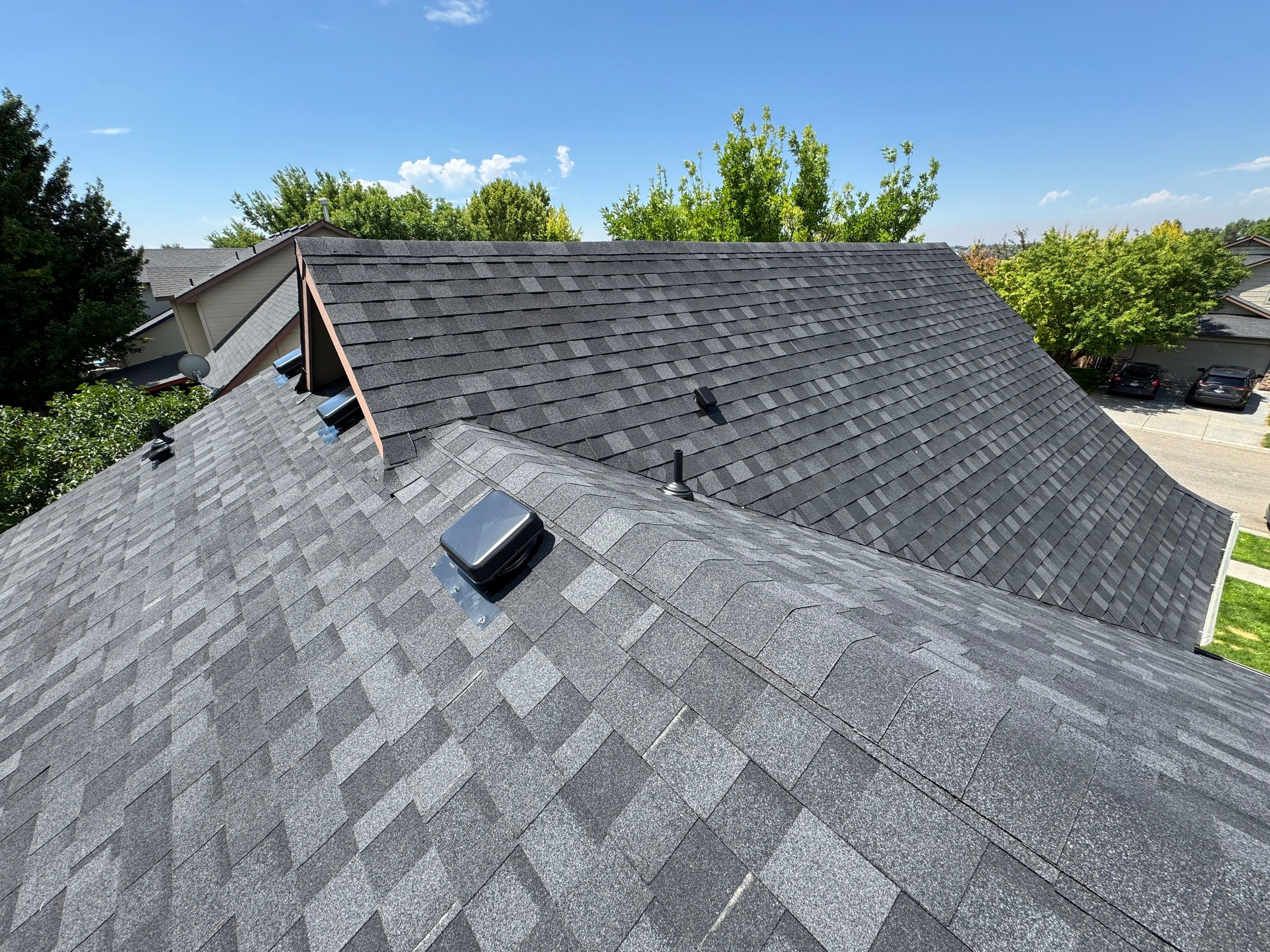 Residential Roof Replacement Featuring Charcoal Grey Architectural Shingles by Olive Roofing