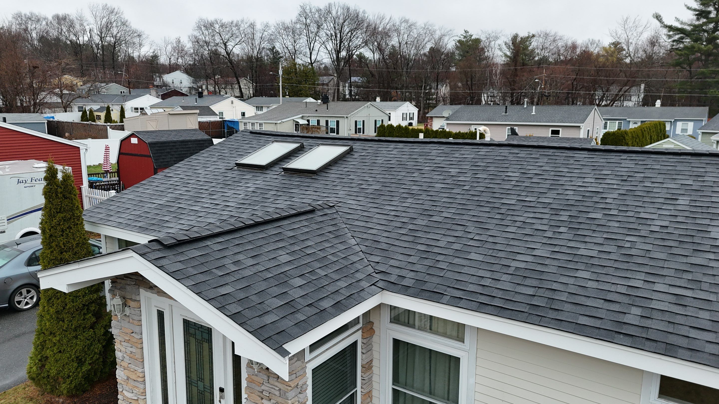 Full Roof Replacement & Complete PVC Trim System in Lowell, MA by Mighty Dog Roofing of Greater Middlesex County