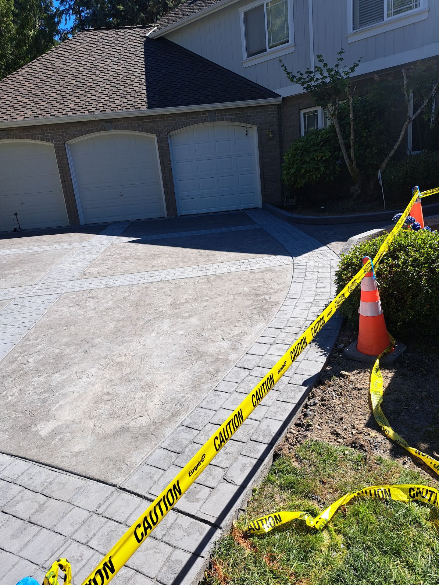 Multi-color Stamped & Sealed Concrete Driveway Renovation | Mukilteo by Jireh Asphalt & Concrete Inc