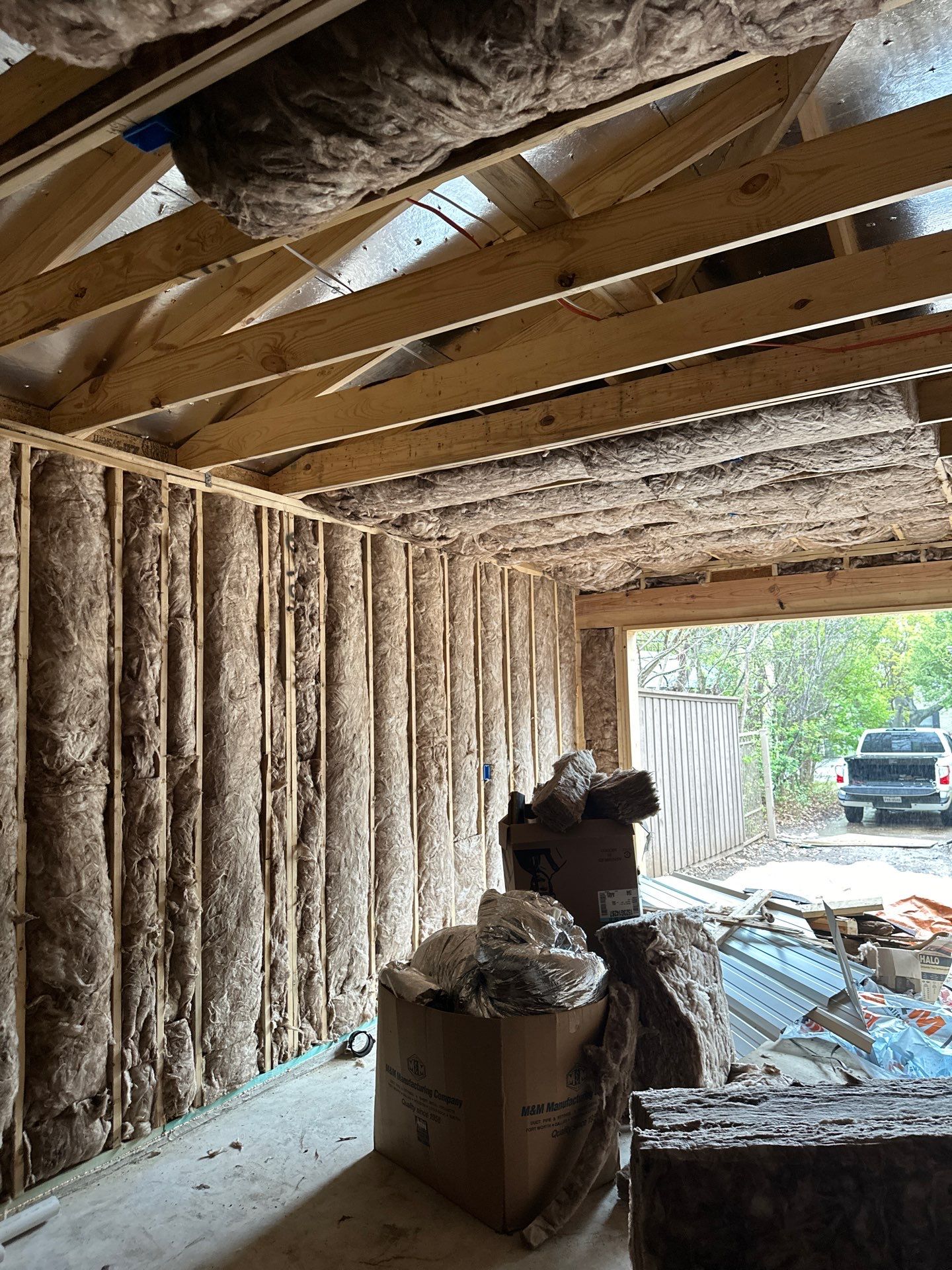 Batt install on Dallas home garage addition with a living suite.  by Apex Insulation Solutions
