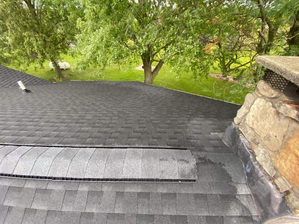 Storm damage roof replacement by Nitro Roofing and Construction