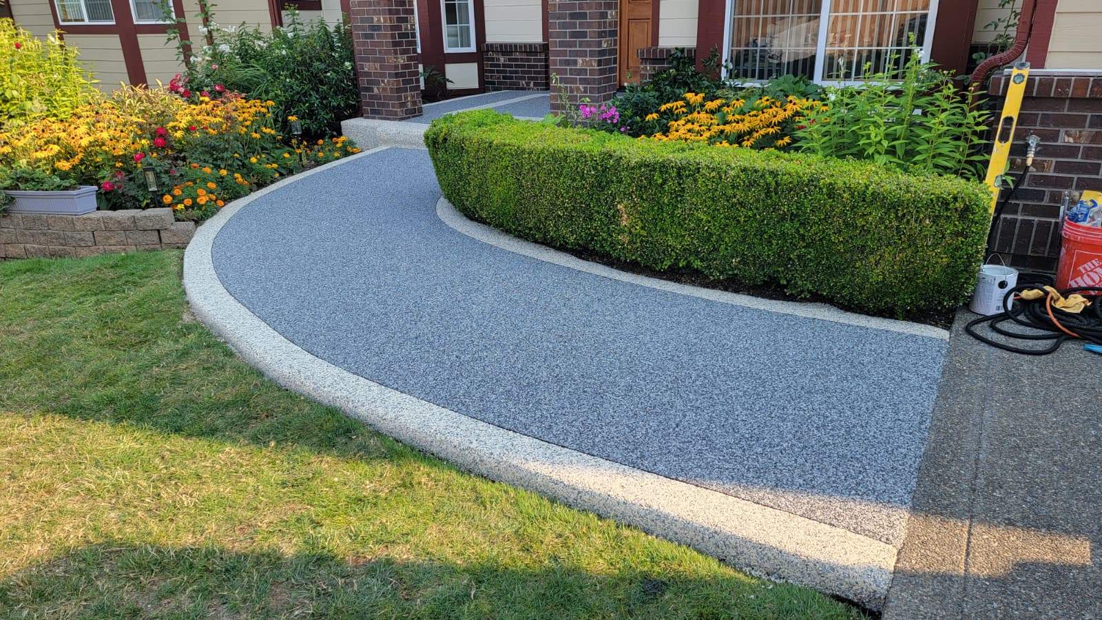 Elegant Walkway and Patio in Palazzo and Santorini Vuba Stone  by Concrete Coating Experts Inc.
