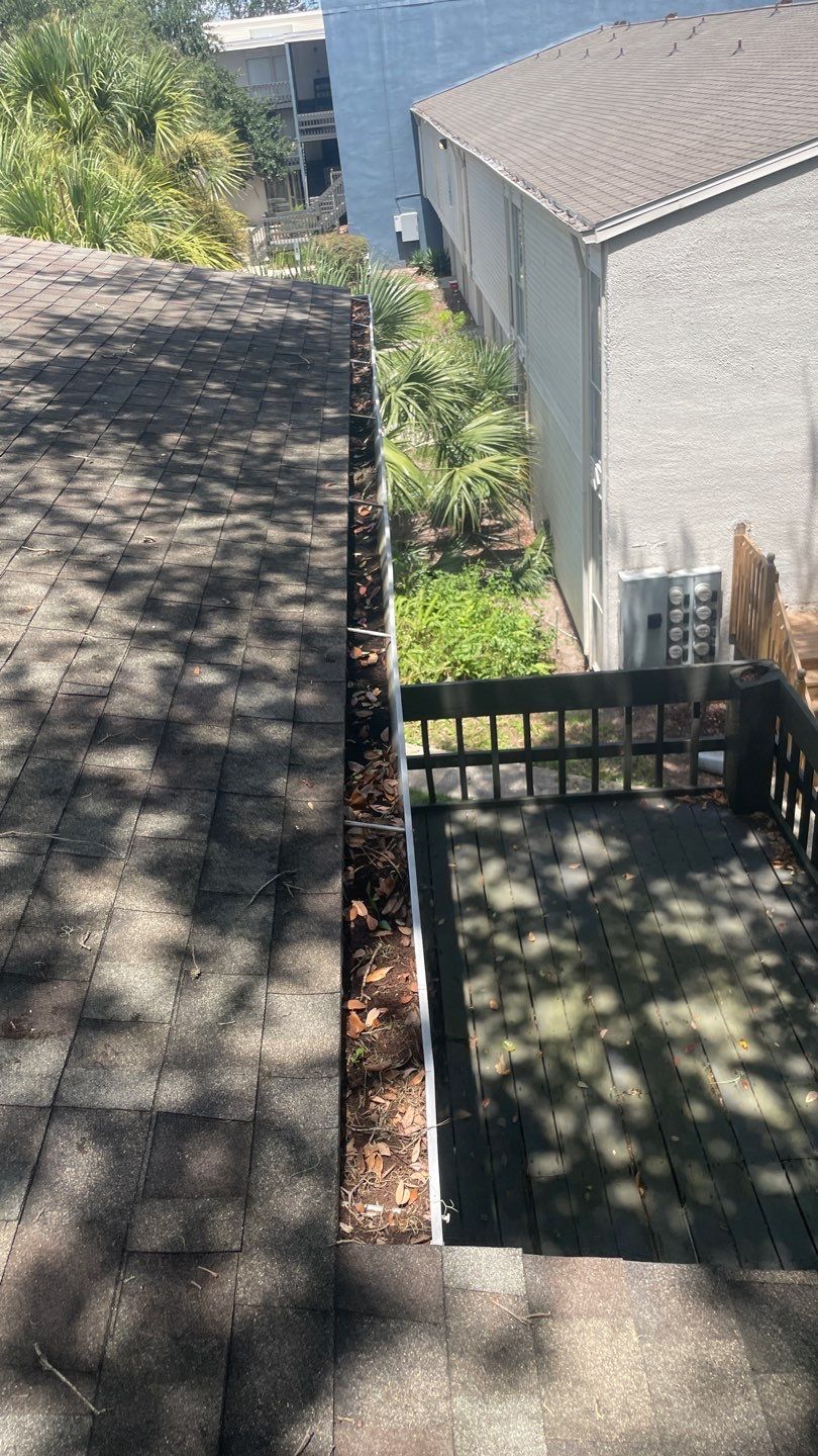 Commercial gutter cleaning Jacksonville, FL before photo with filled gutters