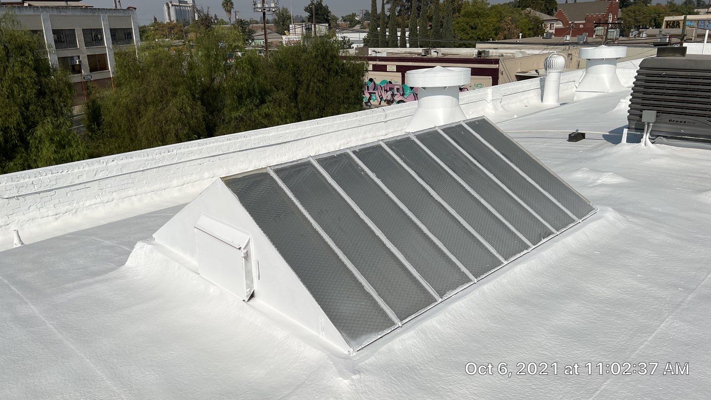 Polyurethane foam roof refurbish and recoating by Straight Edge Roofing Inc