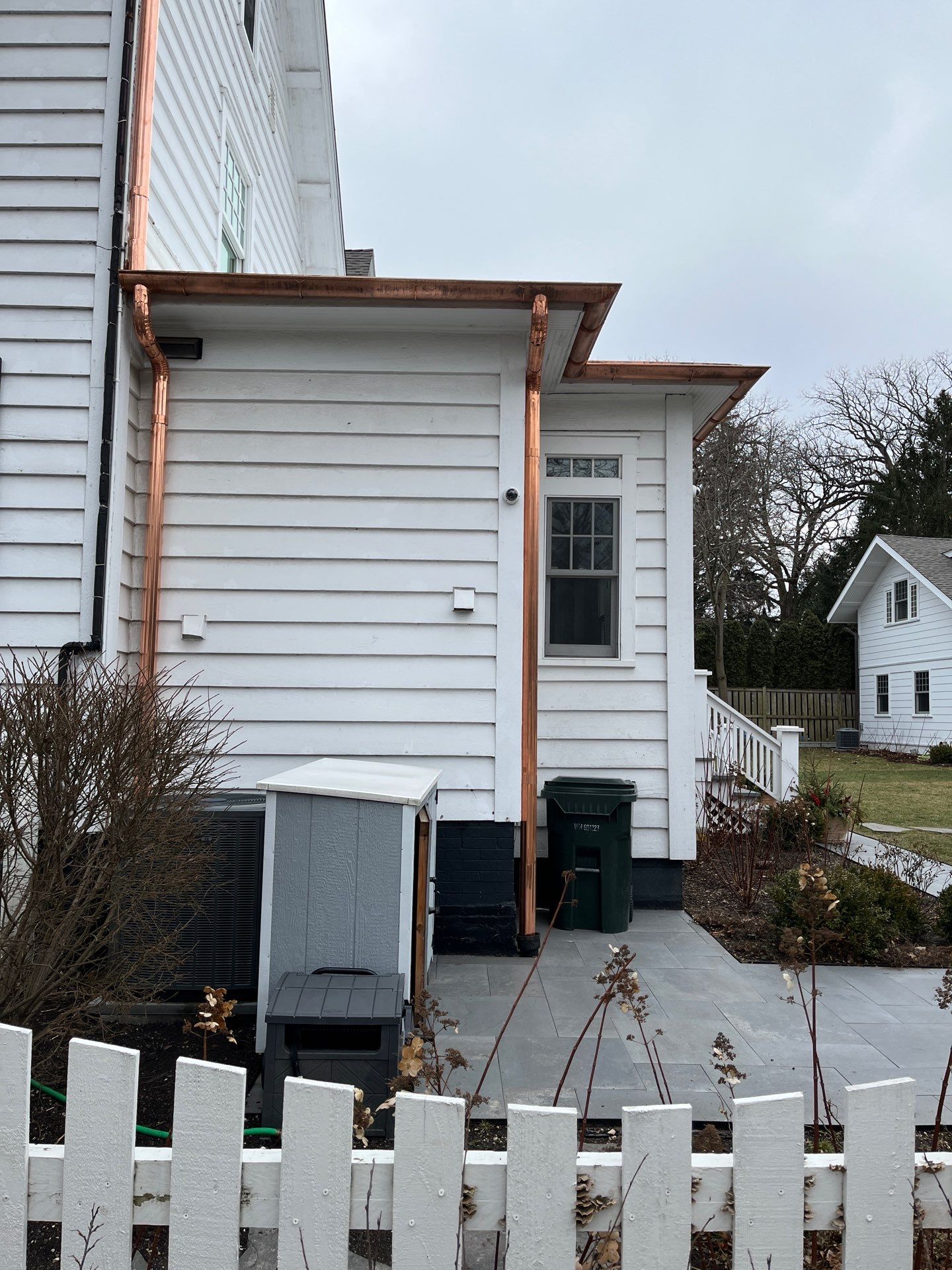 Asphalt Roof Replacement with Half Round Copper Gutter Installment by Custom Installations