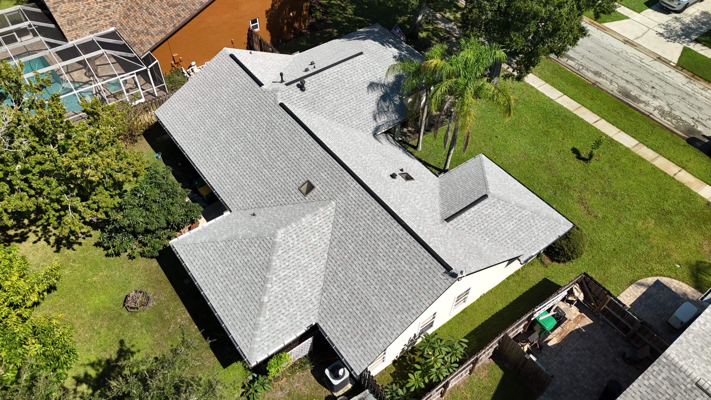 Comprehensive Roof Replacement w/ Old English Pewter Shingles & Black Ridge Vent in Melbourne by Wiedmann Construction & Roofing