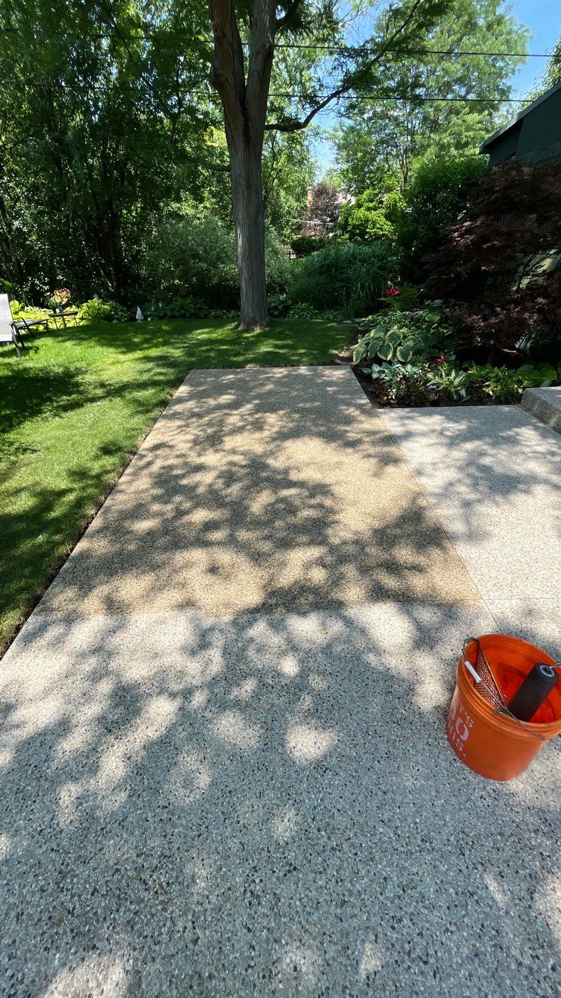 Aggregate concrete cleaning and sealing using Surebond SB-9000 by Northern Power Washing LLC.