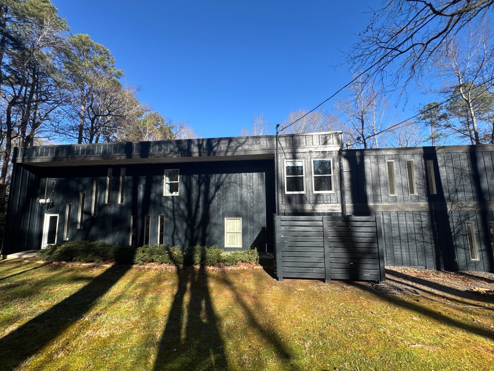 Full Exterior Transformation With Modern Black Finish by Swift Home Renovations