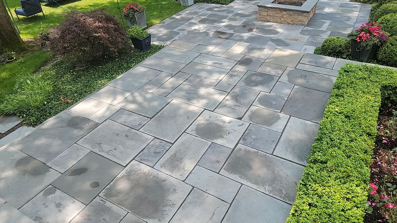 Northbrook, IL stucco home soft wash and stone cleaning by Northern Power Washing LLC.