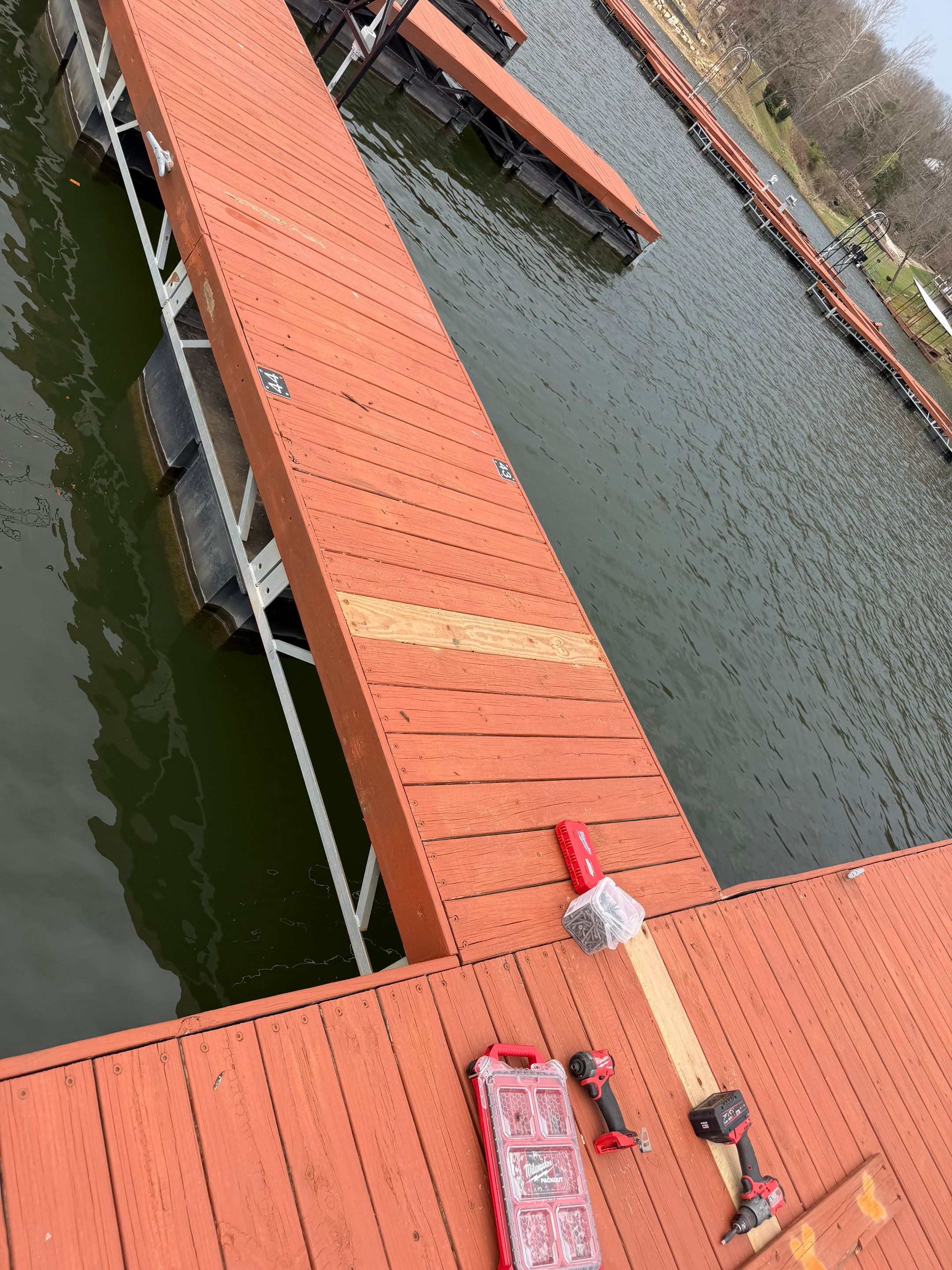 Floating Boat Dock Board Replacement and Staining in New Florence by Acute Roofing And Exteriors