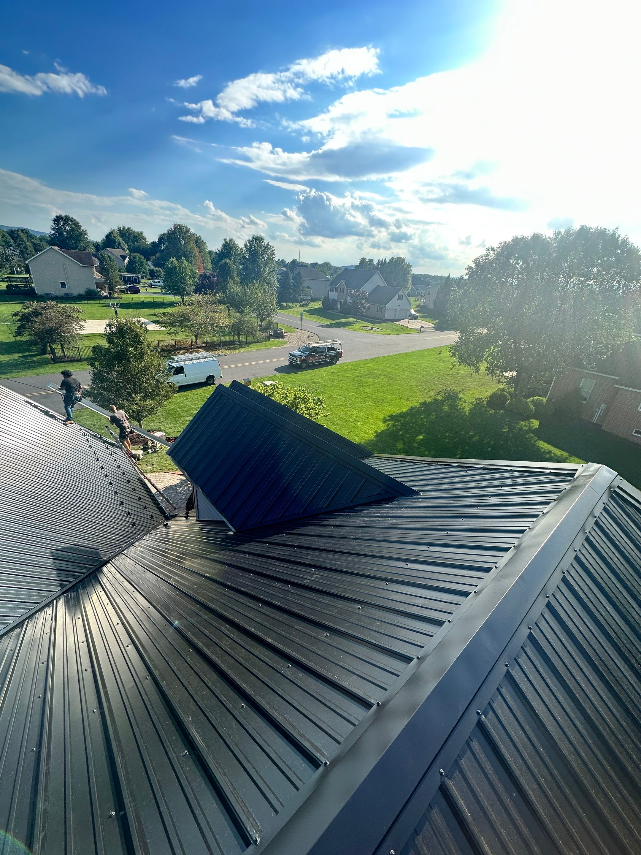 Standing seam / Azm panel in black  by Teflon Roofing