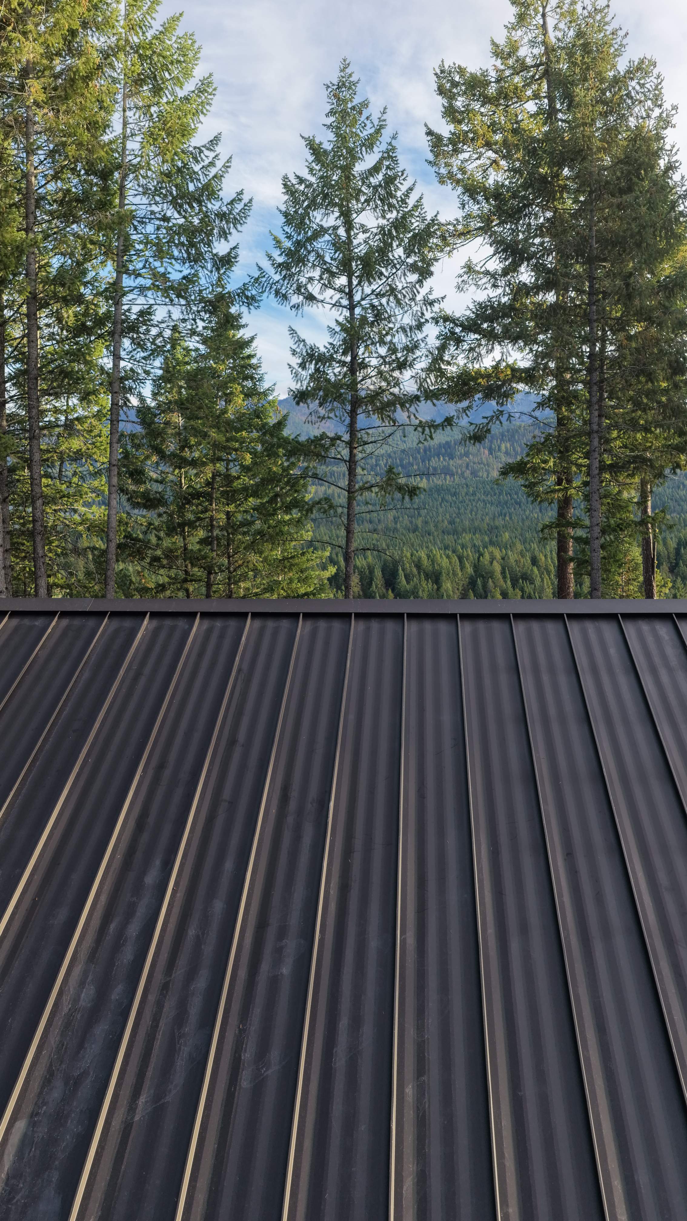 Mechanical Lock Standing Seam - CMG ULG Dark Bronze  by Montana Roofing Solutions