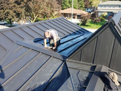 Residential Roofing Installation using 16" Standing Seam Panels