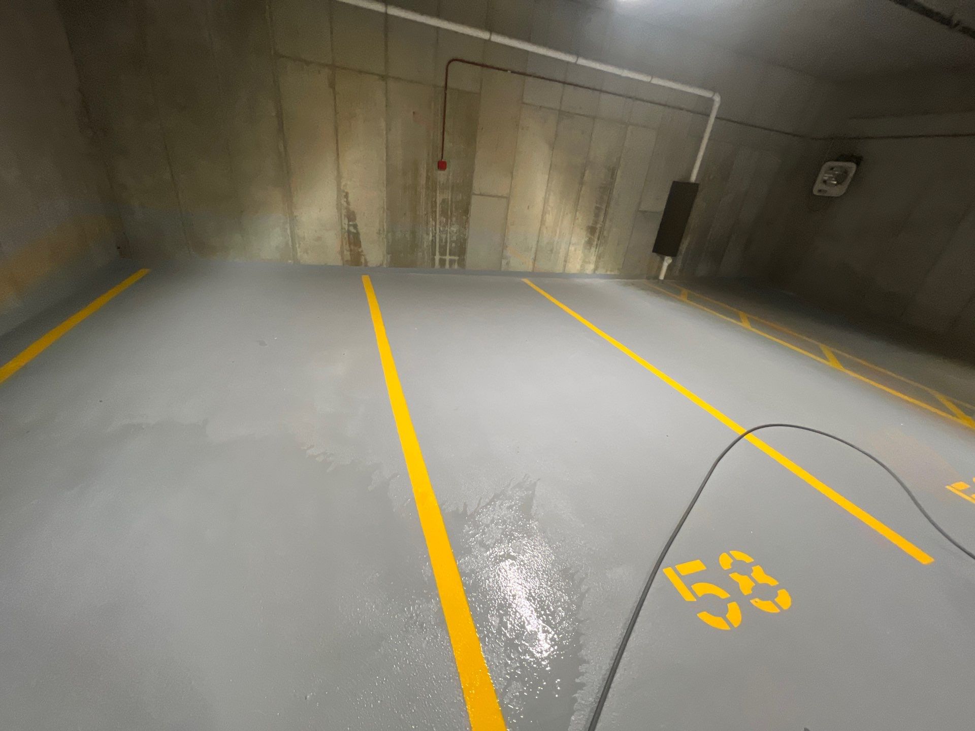 Parking garage using Hot water by Northern Power Washing LLC.