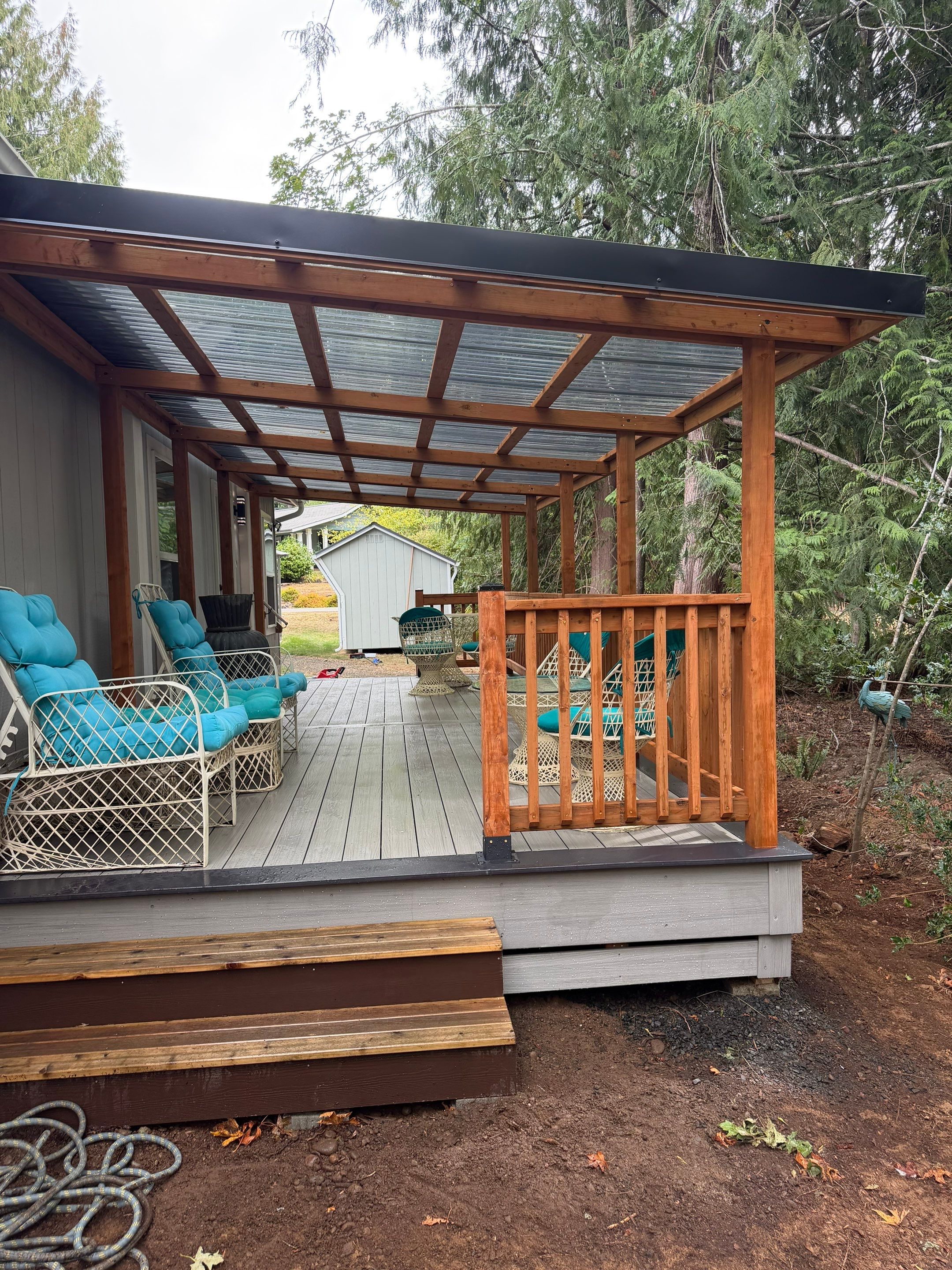 Covered Composite Deck with Translucent Pergola Roof in Port Orchard by Expedeck