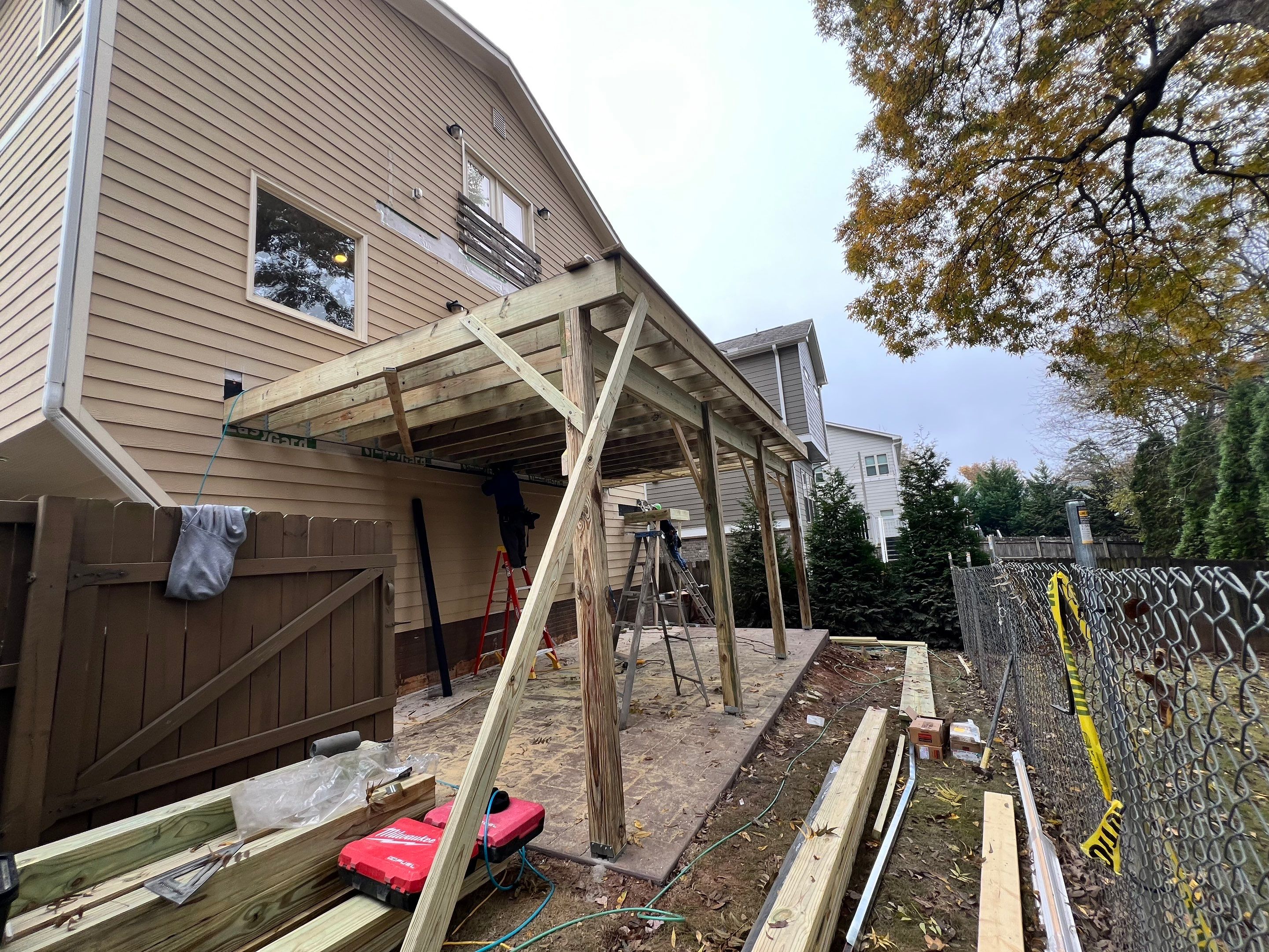 Screened-In Porch With Fireplace by Swift Home Renovations 