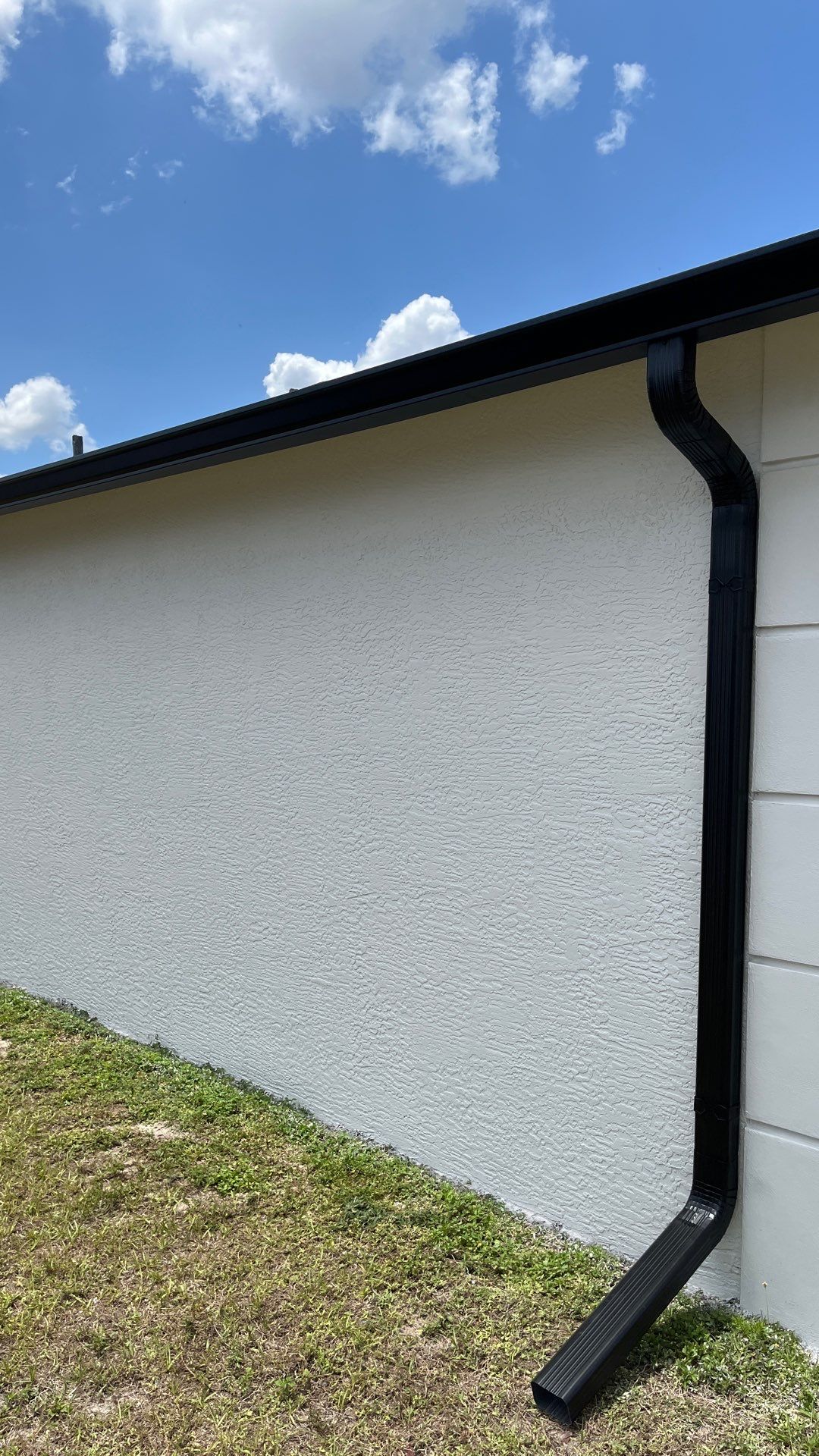 Black Seamless Gutters and Downspouts in Fort Myers FL by Gutter Professors