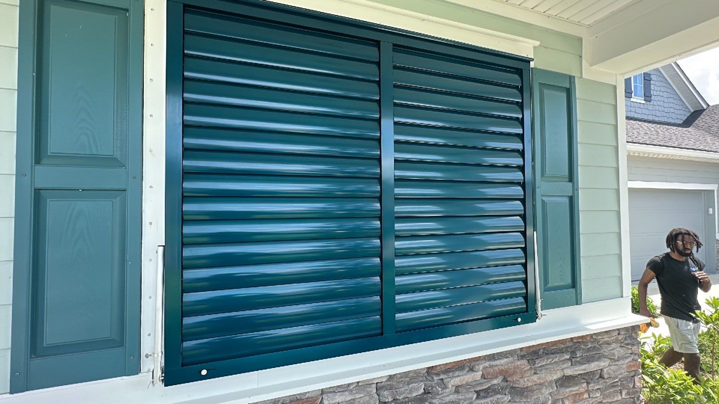 Hurricane Rated Bahama Shutters in Ocean Blue by Smart Guard Shutters