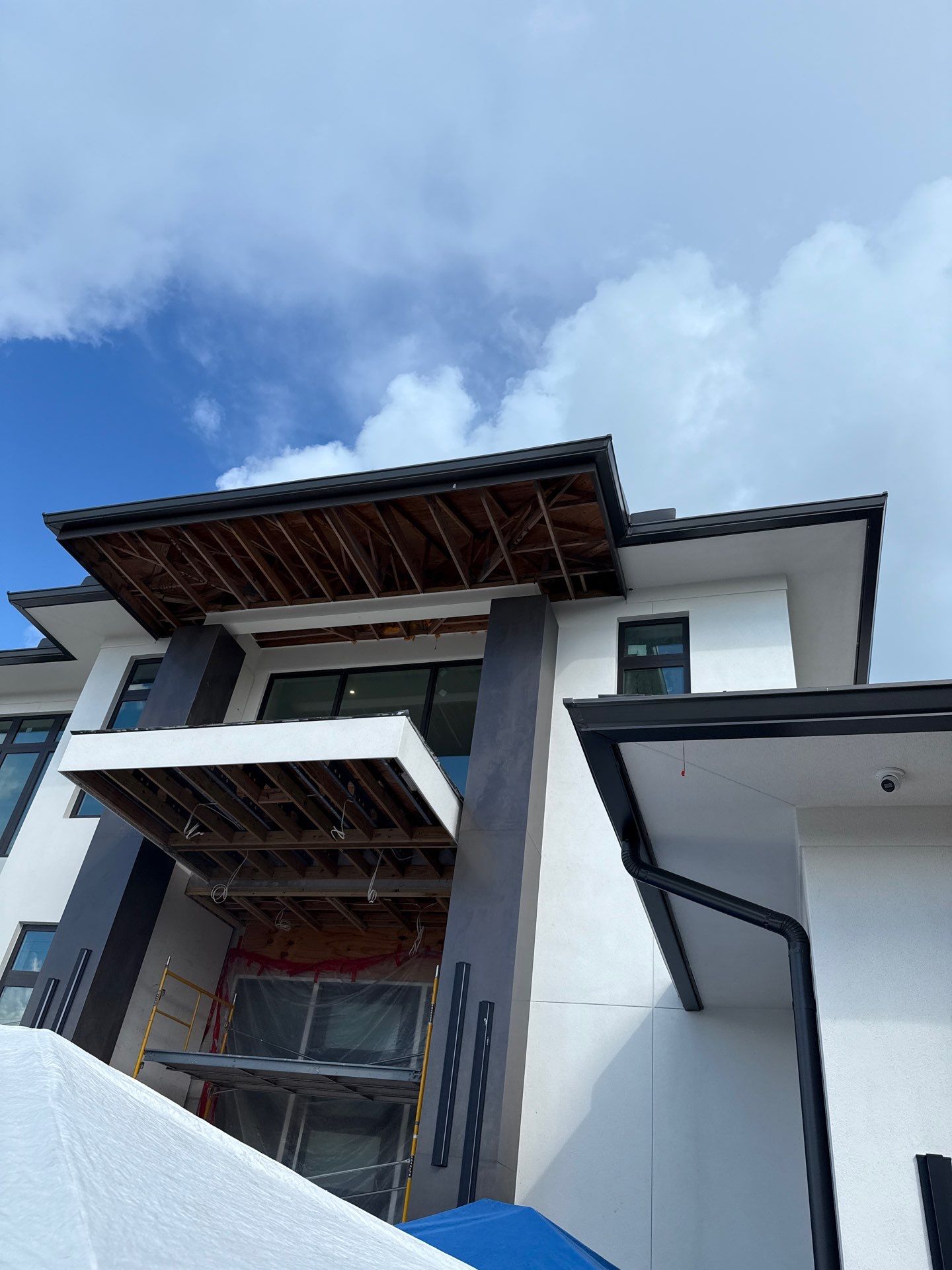 Seamless Aluminum Gutter Installation using black seamless gutters in Sarasota FL by Gutter Professors