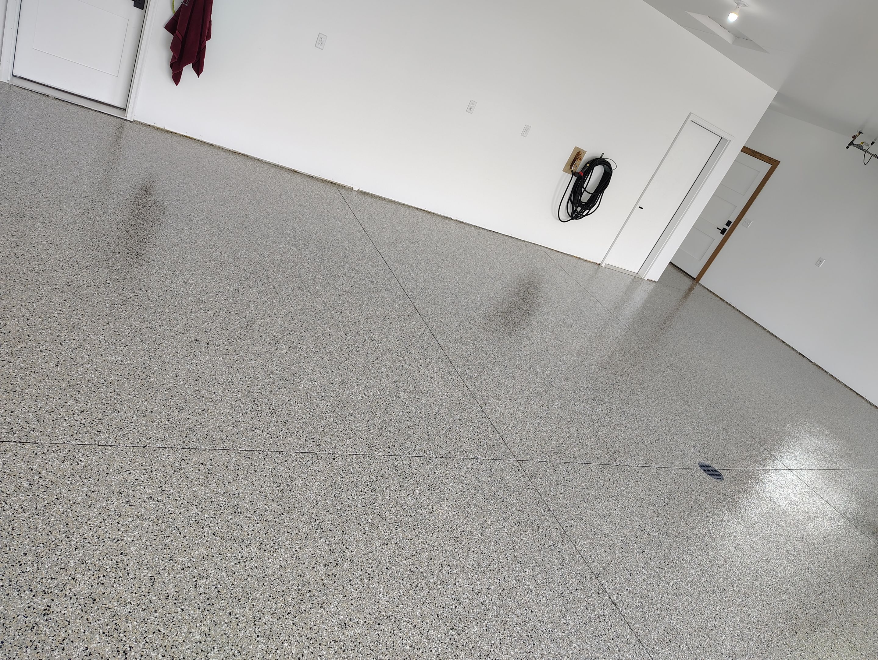 Gray and White Speckled Epoxy Garage Floor Coating in Tea by Select Painting, Coatings & Garage Cabinets