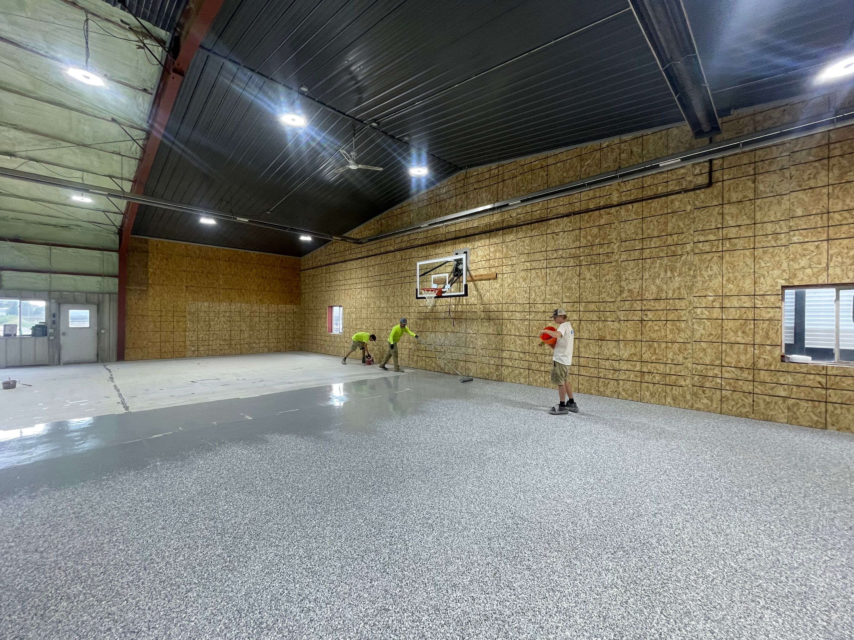 Custom Polyurea Shop Floor with Basketball Court Lines in Rock Valley by Select Painting, Coatings & Garage Cabinets