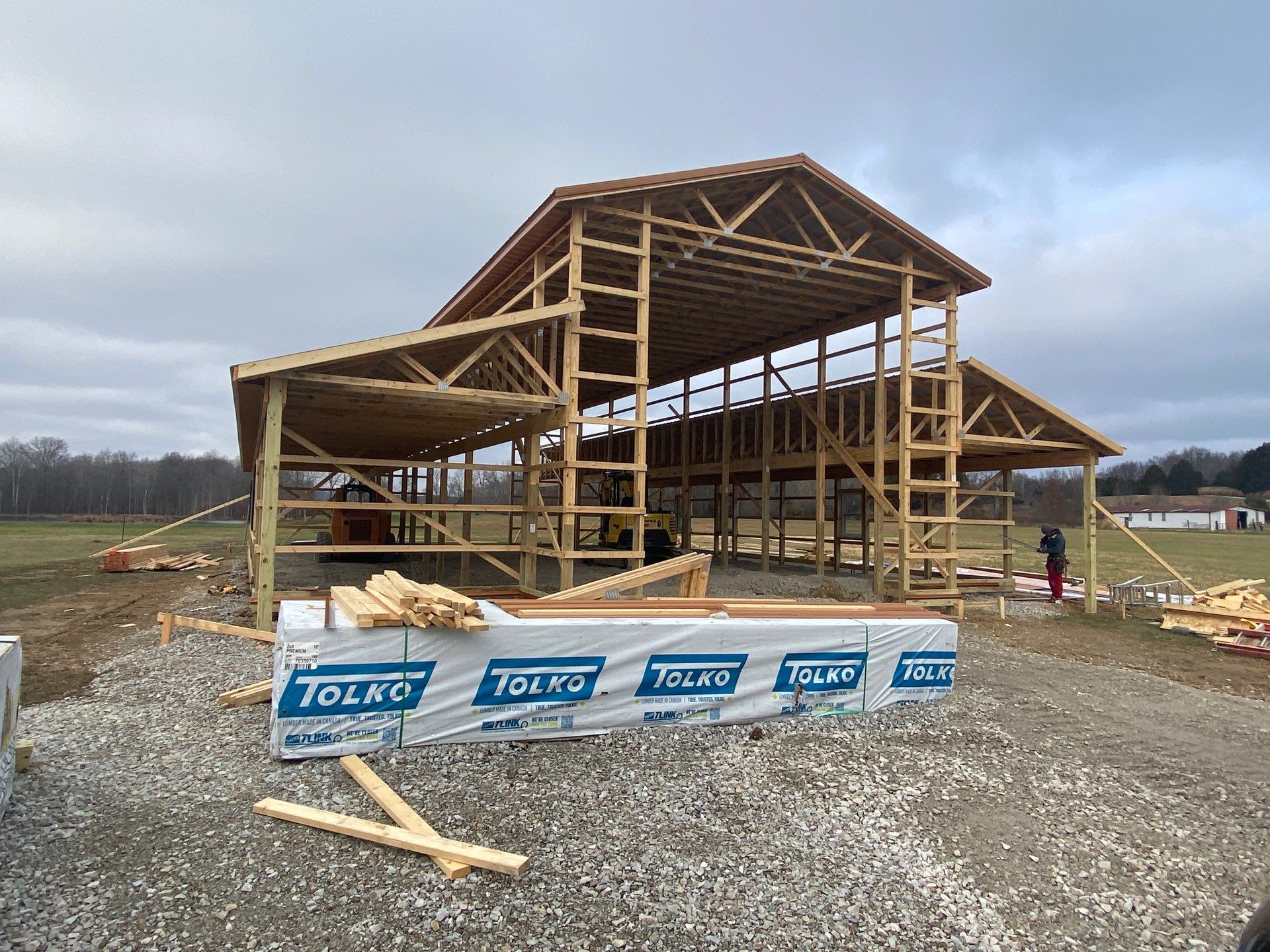 Custom Pole Barn Home with Charcoal Siding and Copper Roof by The Barn Builders