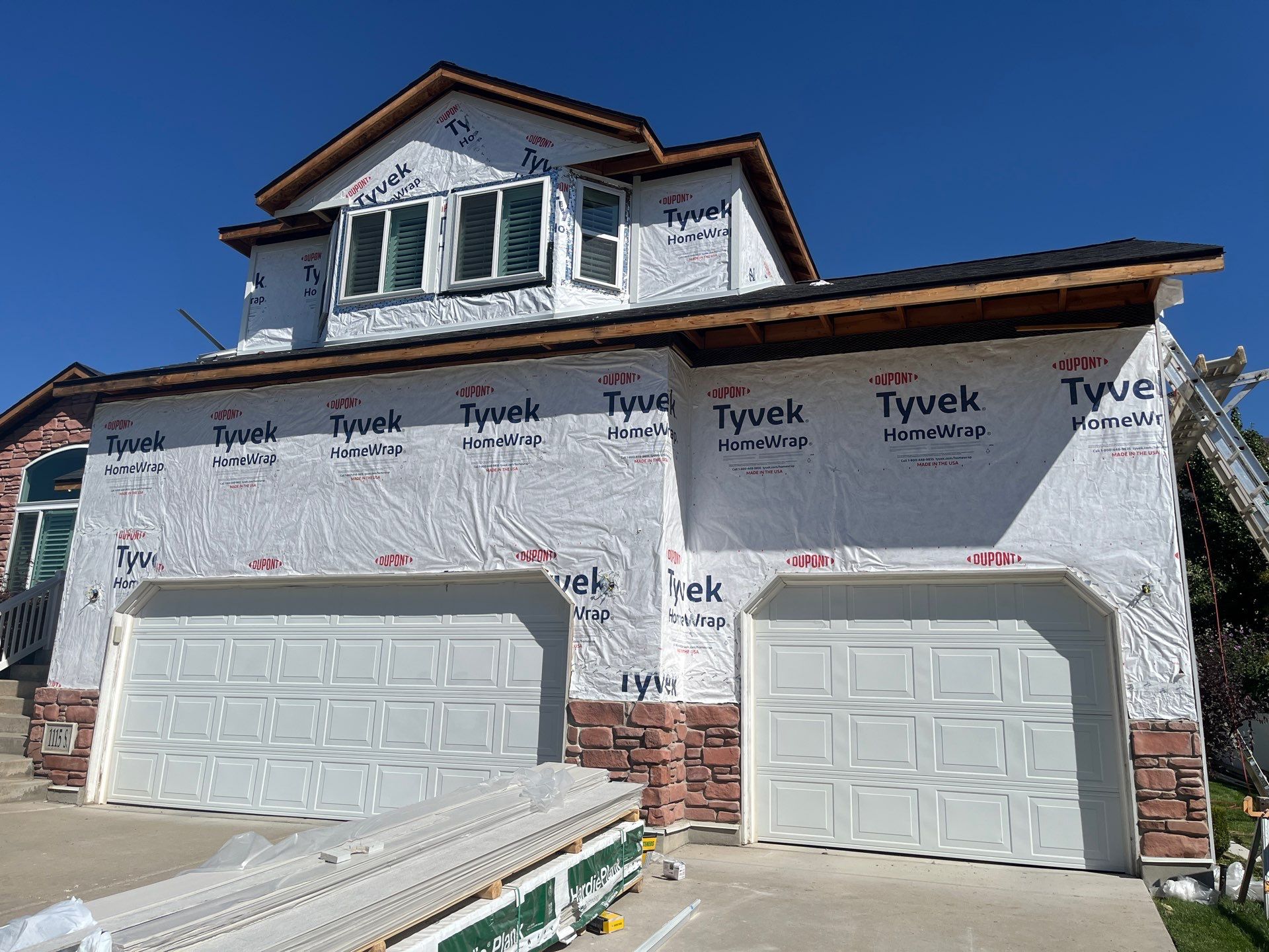 Farmington | Stucco/Vinyl Demo & Hardie Conversion | Cobble Stone & Black by Ideal Siding Utah