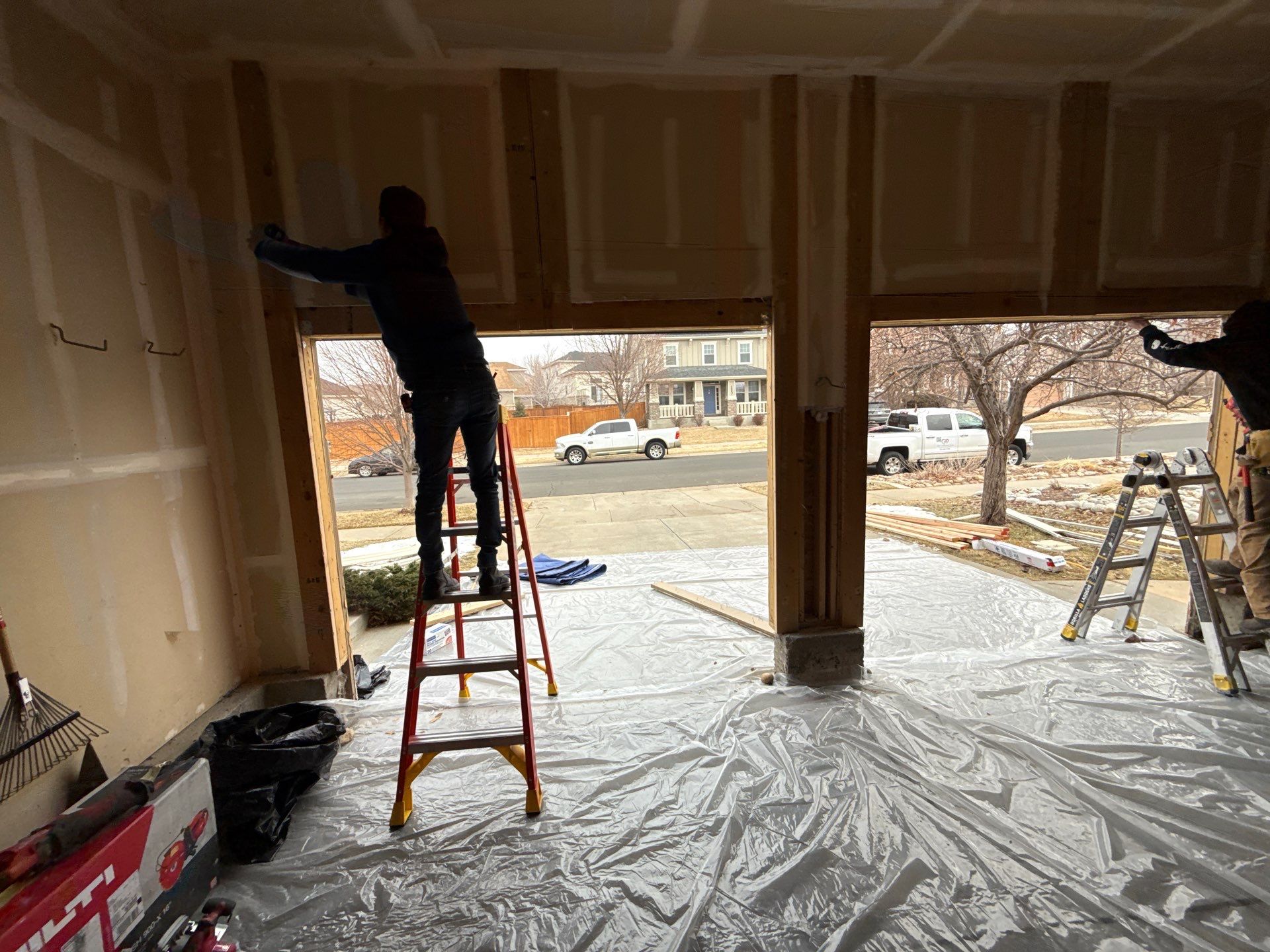 Garage door conversion by David & Goliath Contracting 