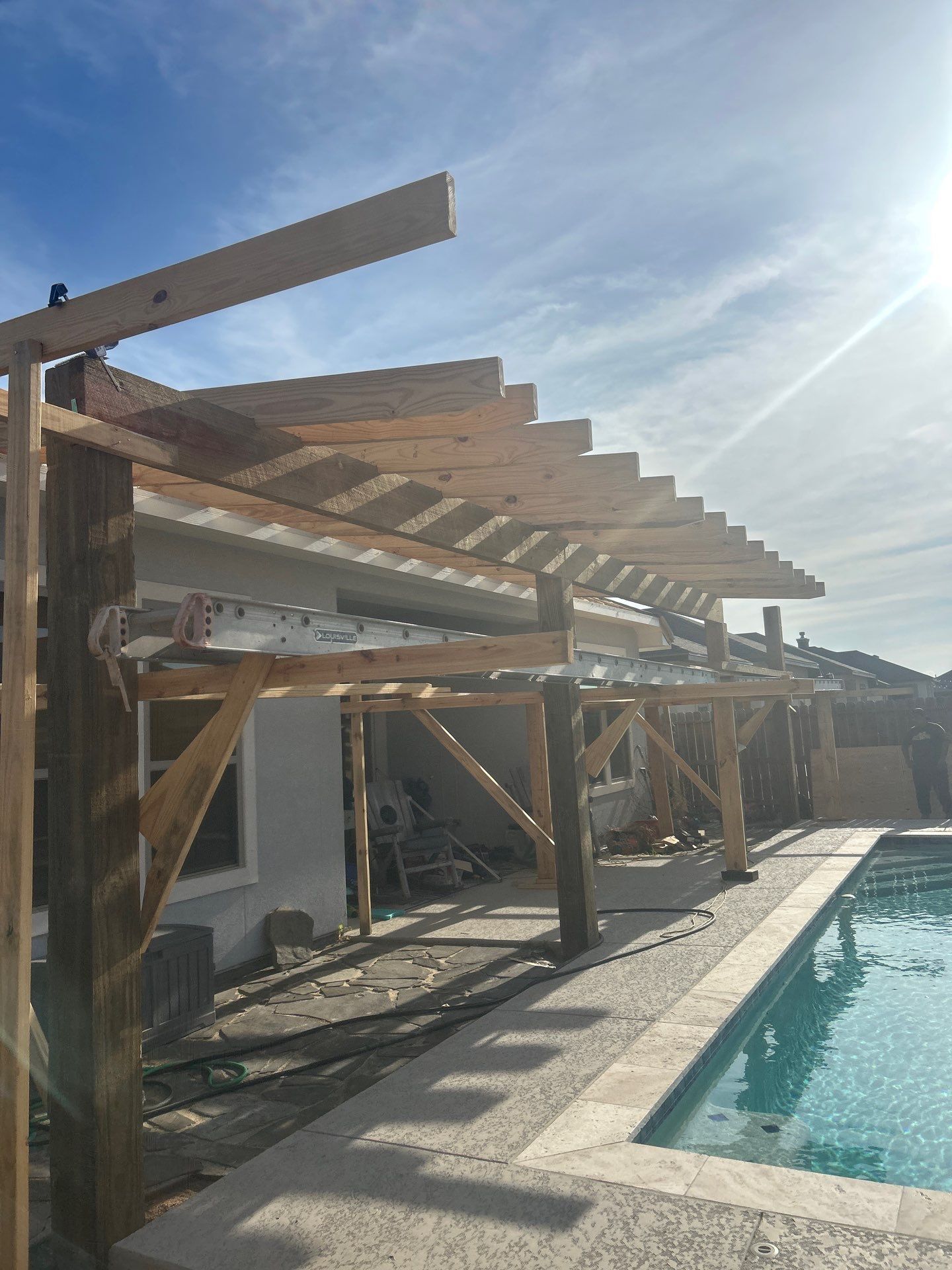 Patio Pool Cover by Bayfront Roofing and Construction