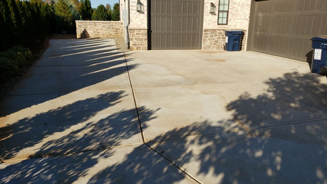 Driveway Clean using cleaner by Power Wash Masters LLC