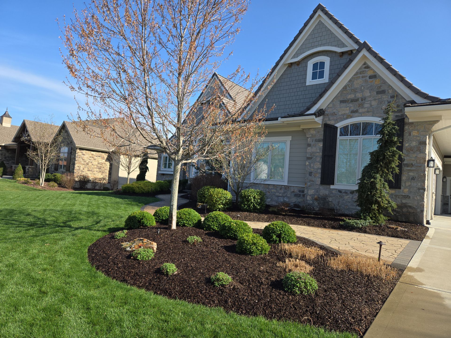 Front Yard Landscape and Walkway Renovation in Overland Park by LAND ESCAPES LLC