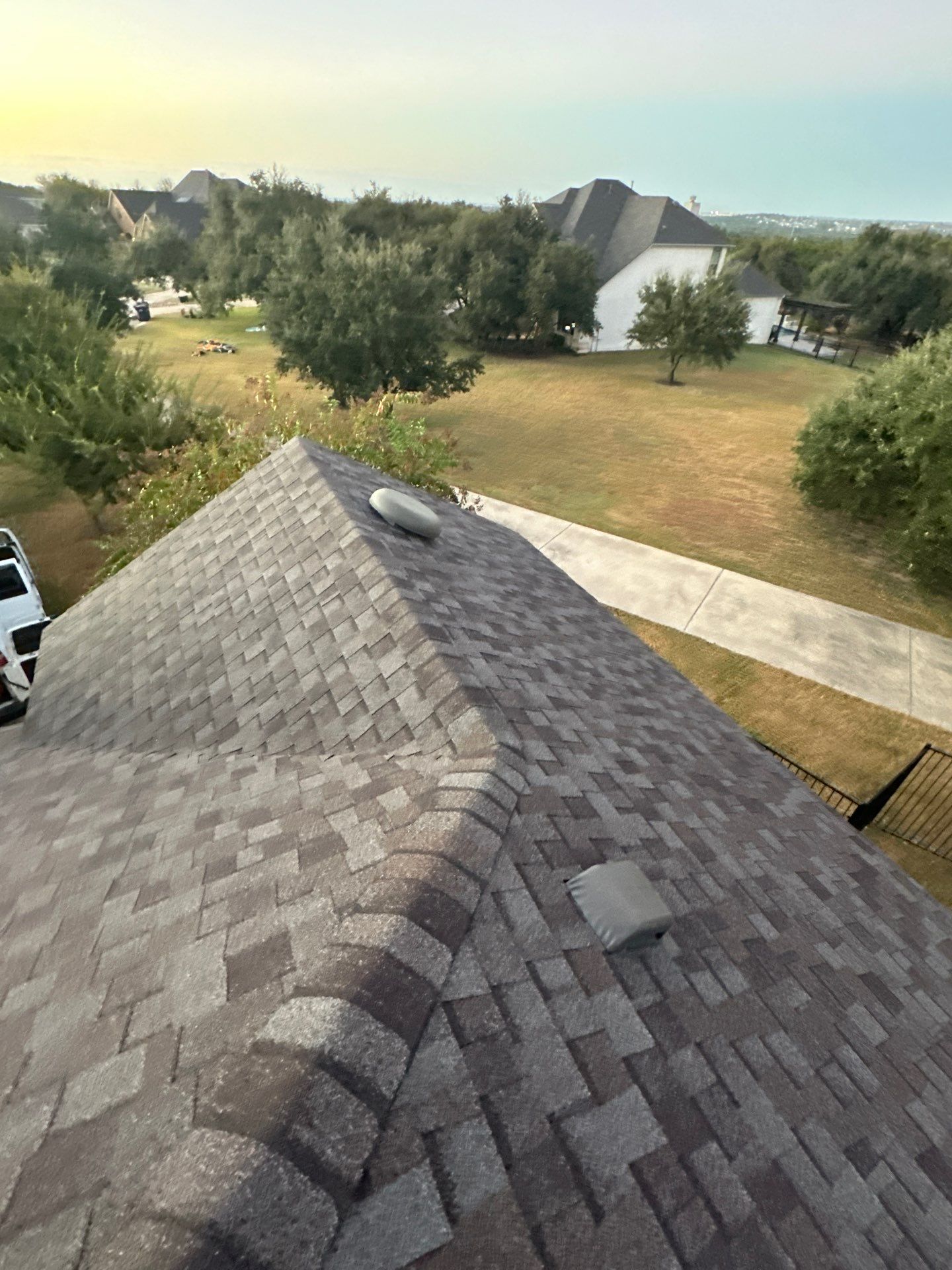 Hail Damage Roof Replacement & Gutter Upgrade in Leander, TX by Cool Roofs