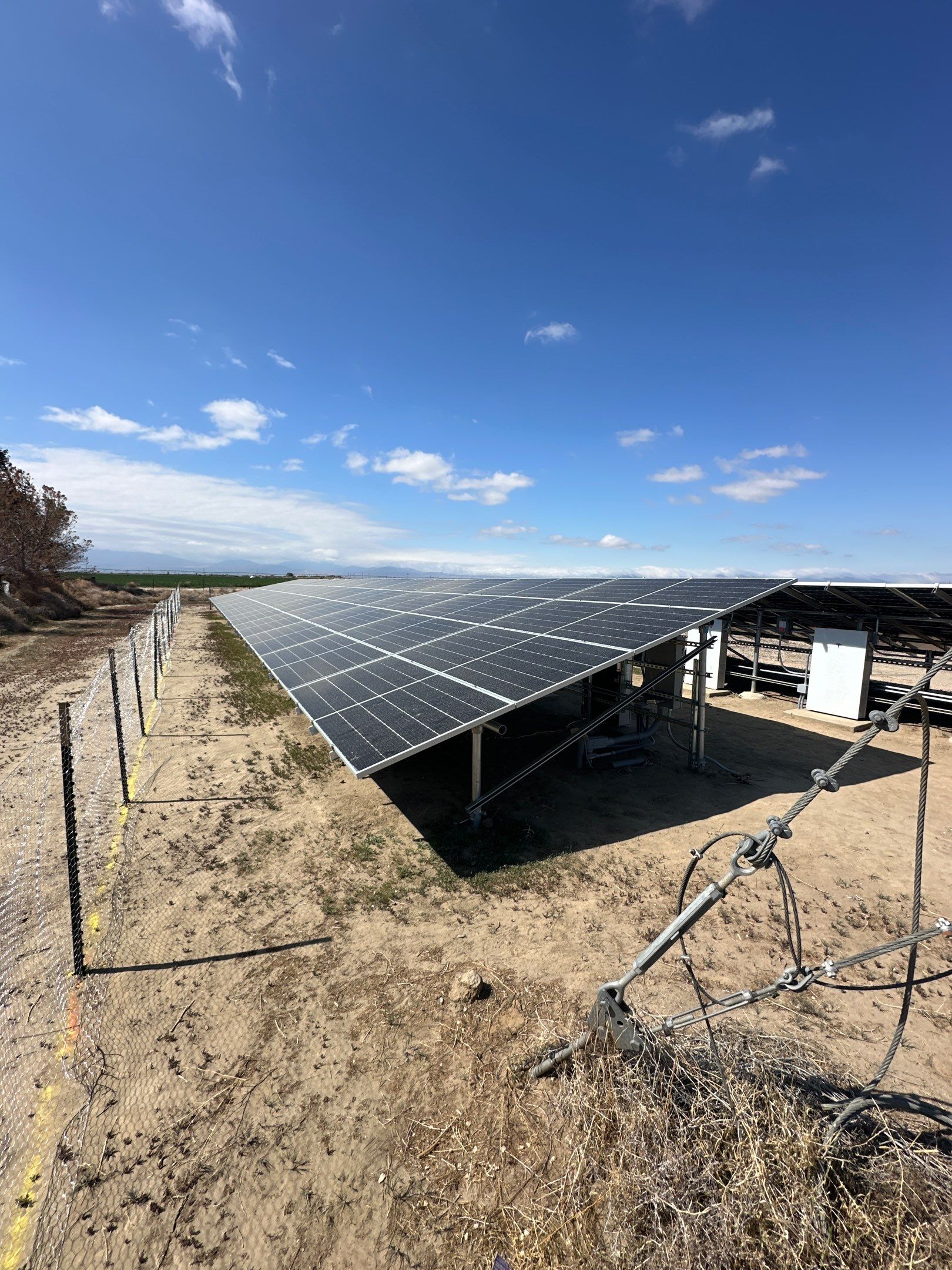 Large-Scale Ground-Mount Solar and Tesla Powerwall Battery Installation by AWS Solar