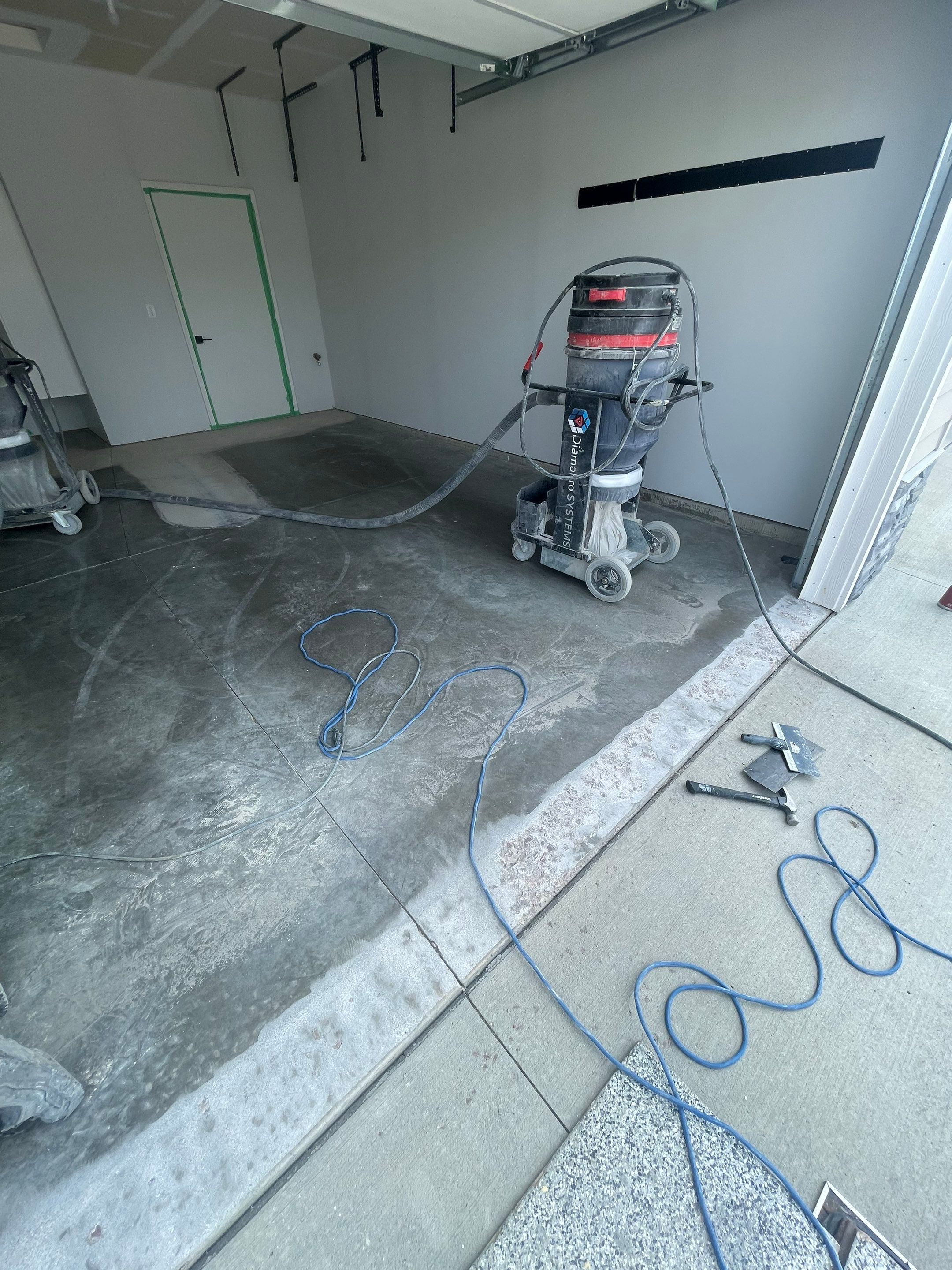 Custom Coyote Flake Garage Floor Coating in Sioux Falls by Select Painting, Coatings & Garage Cabinets