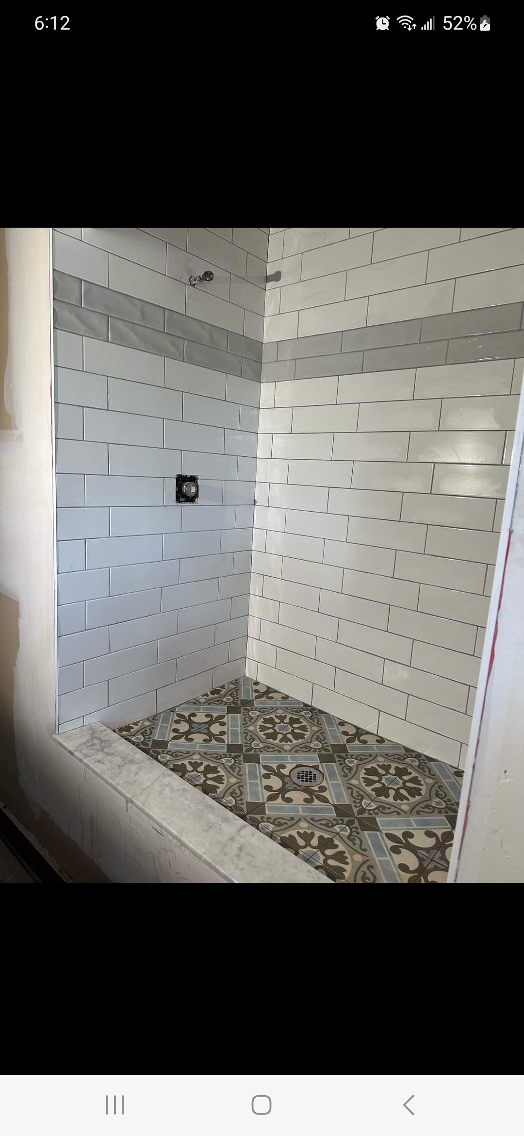 Jack & Jill Bathroom Floor + Dog Washing Nook with Niche using Porceline Subway Tile by Footprints Floors Morristown