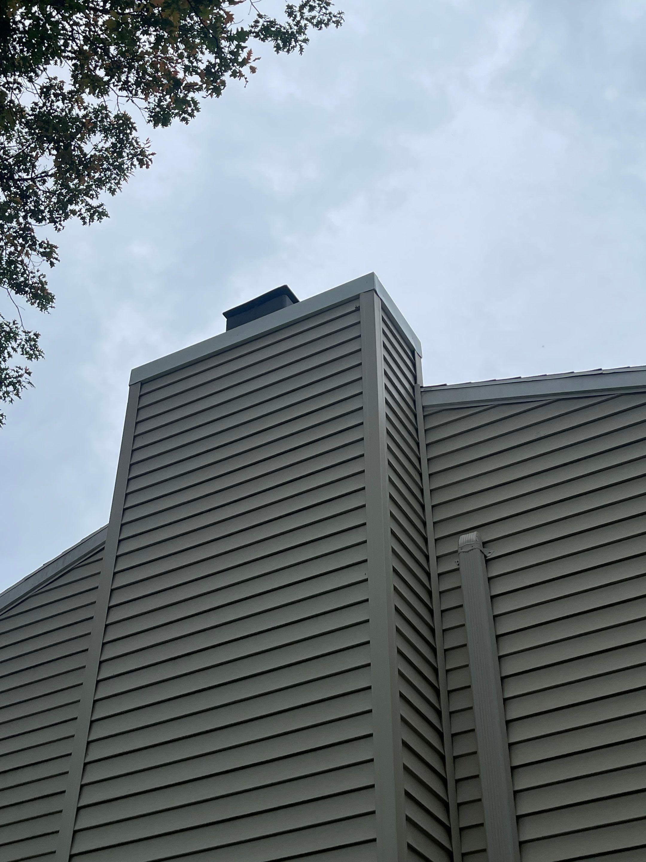 Gutter Cleaning Chimney top repair by A Plus Exterior