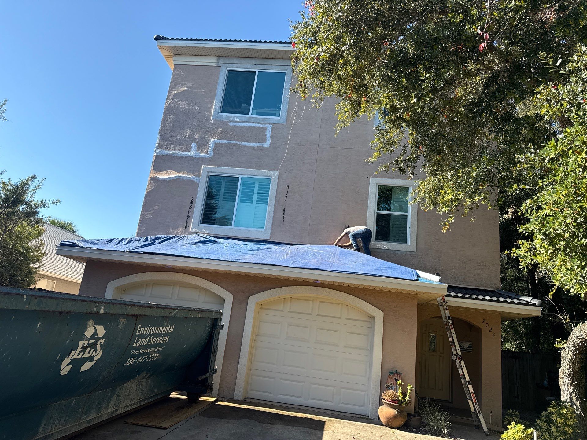 Flagler Beach Residential Tile Roof Replacement with Dark Barrel Tiles by Fortified Roofing Solutions Corp.