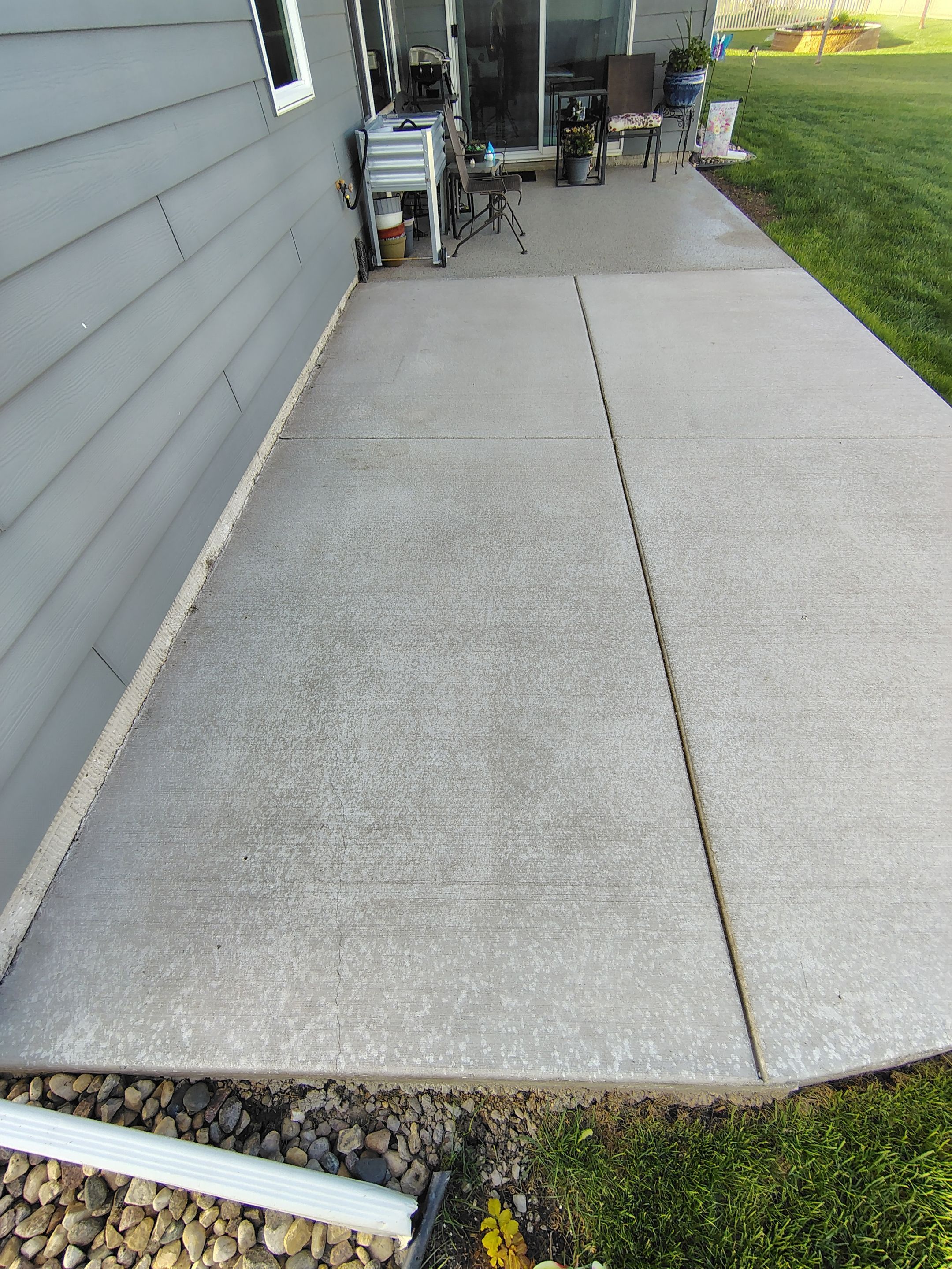 Speckled Concrete Patio Coating Installation in Sioux Falls by Select Painting, Coatings & Garage Cabinets