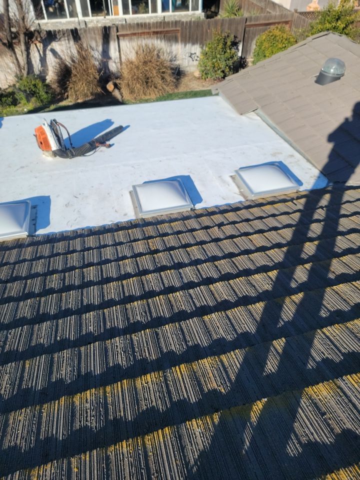 Single-ply roofing system on porch using TPO 60 mil by Straight Edge Roofing Inc