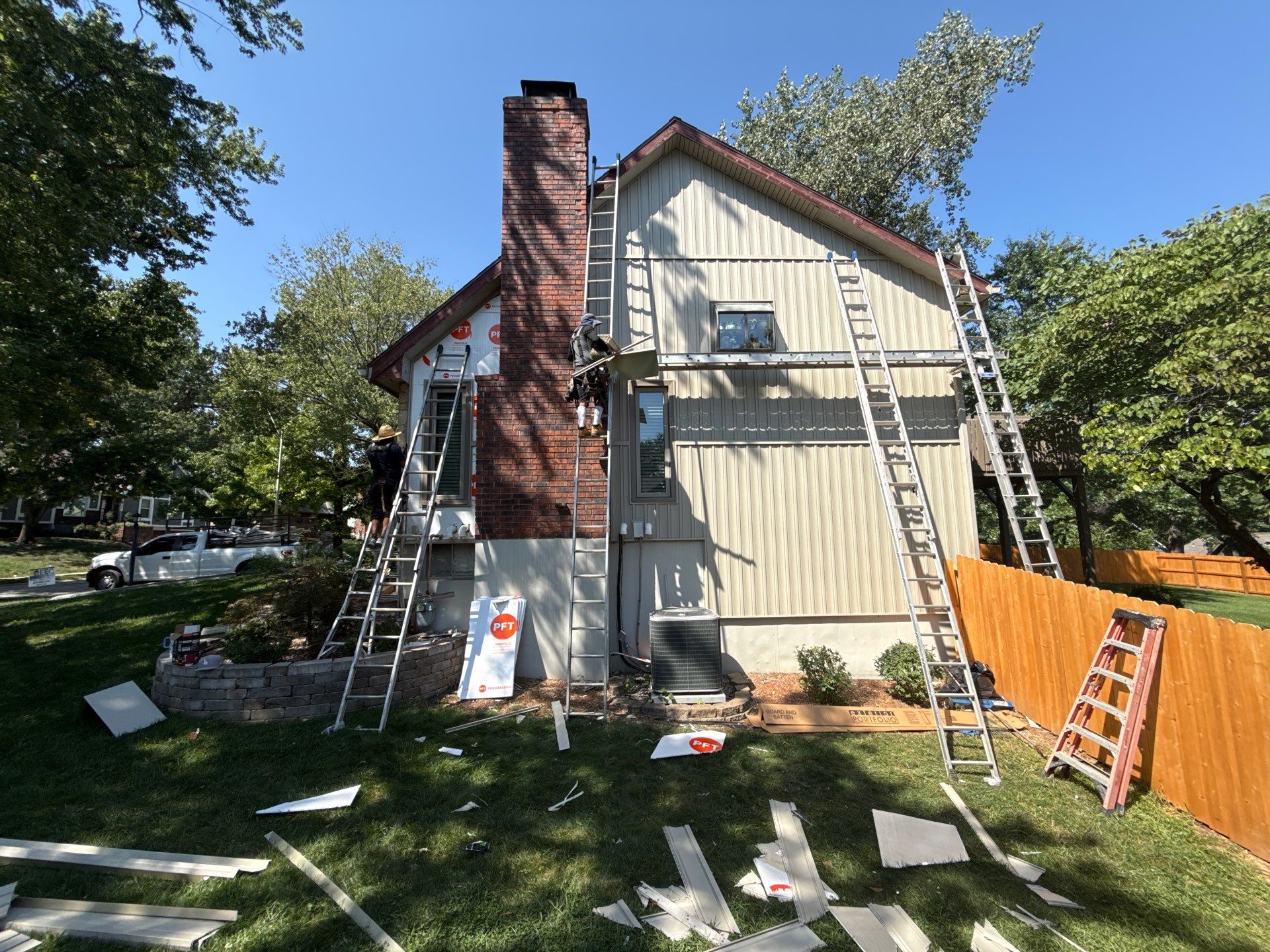 Comprehensive Kansas City Exterior Remodel Featuring Board And Batten Siding by EEC Windows, Siding & Roofing